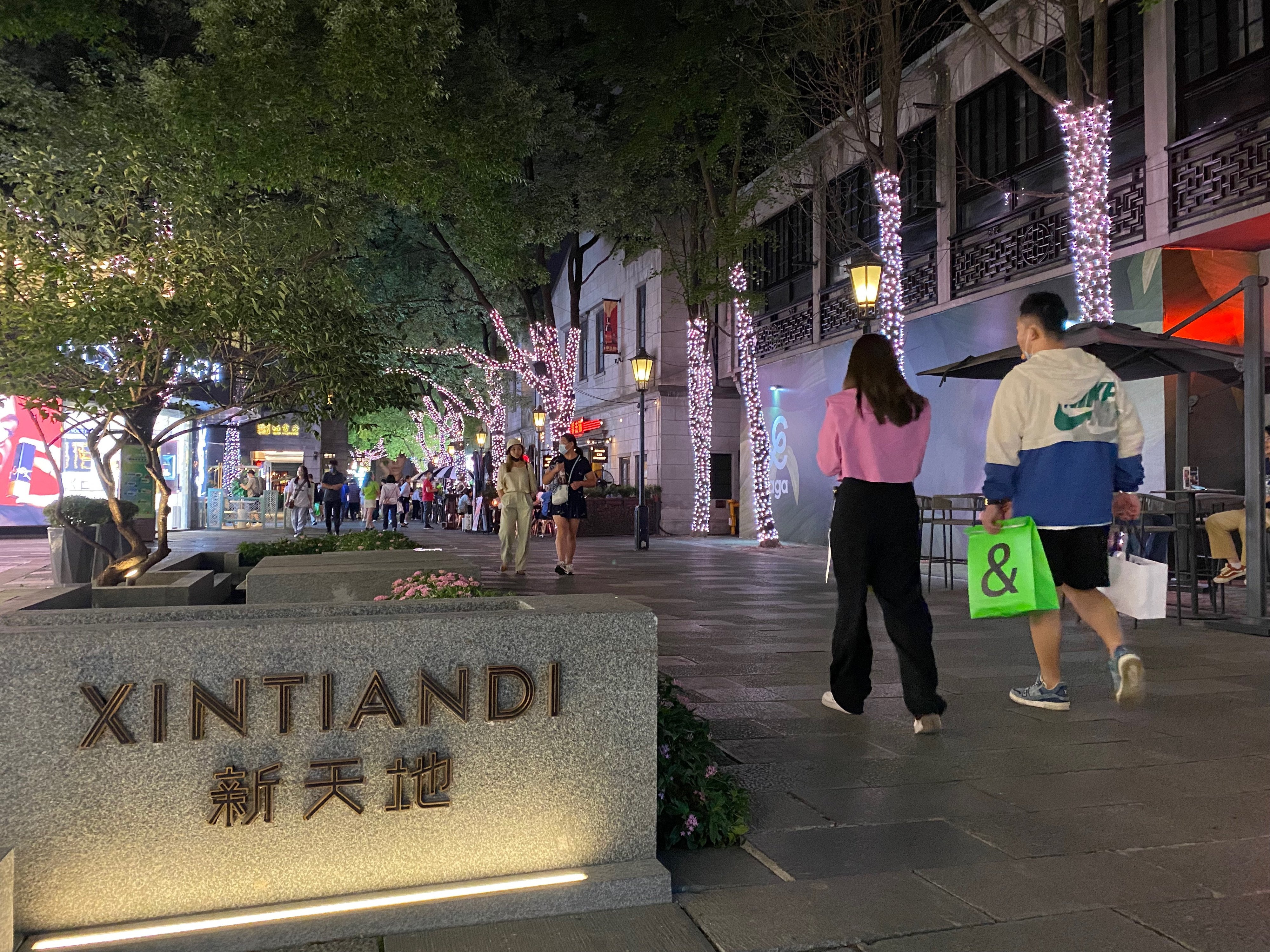 People walk past a commercial compound in Xintiandi, Shanghai in September 2022. Photo: Yaling Jiang