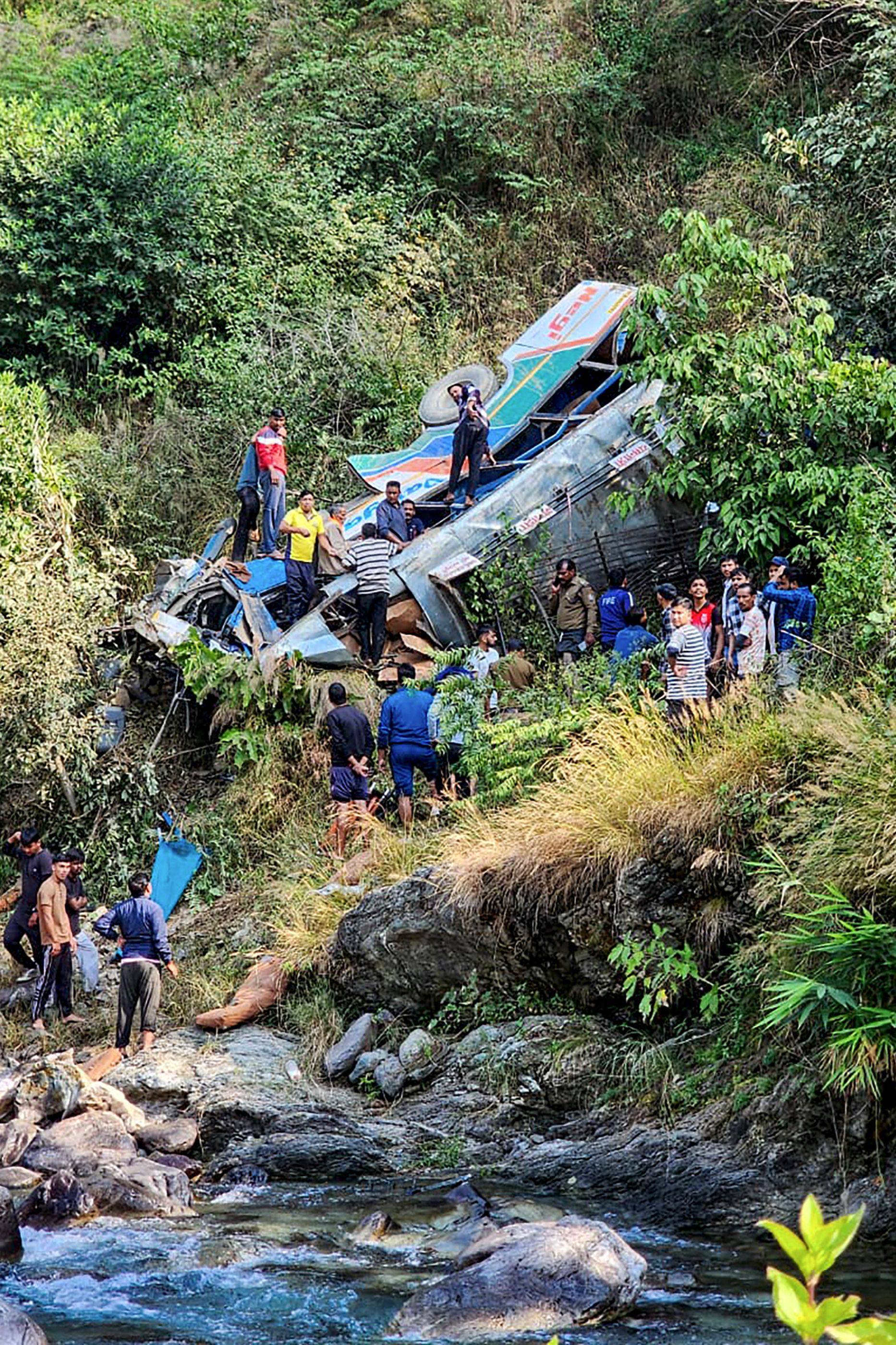 A bus veered off the road and plunged into a deep gorge in northern India on Monday, killing at least 24 people and injuring several others, officials said. Photo: AFP/ DIPR Uttarakhand 