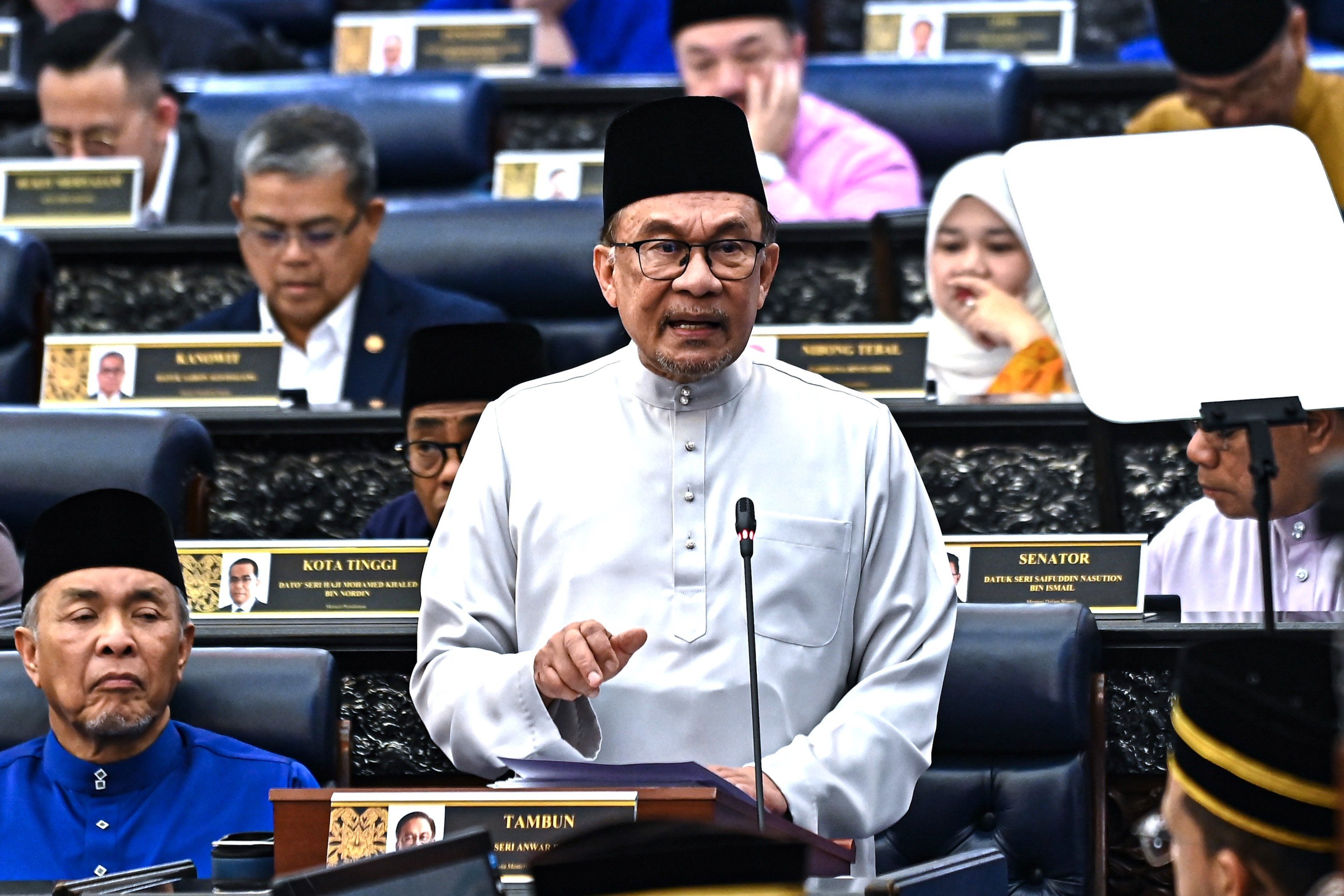 Malaysia’s Prime Minister and Finance Minister Anwar Ibrahim delivering his speech on the 2025 national budget at the Malaysian Parliament in Kuala Lumpur on October 18. Photo: EPA-EFE