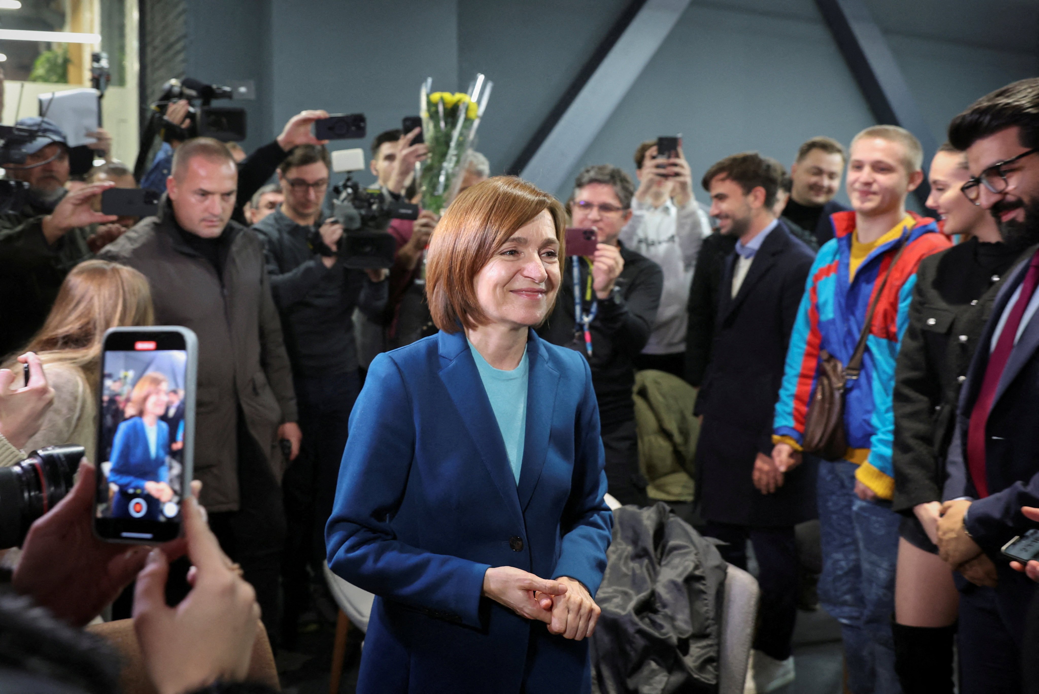 Moldova’s President Maia Sandu celebrates with supporters at her campaign headquarters in Chisinau, Moldova on Sunday. Photo: Reuters 