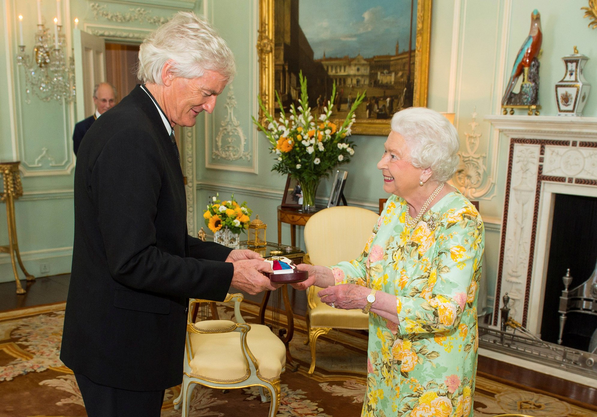 Britain’s Queen Elizabeth presents businessman James Dyson with the insignia of members of the Order of Merit during a private audience at London’s Buckingham Palace in 2016. Photo: Reuters