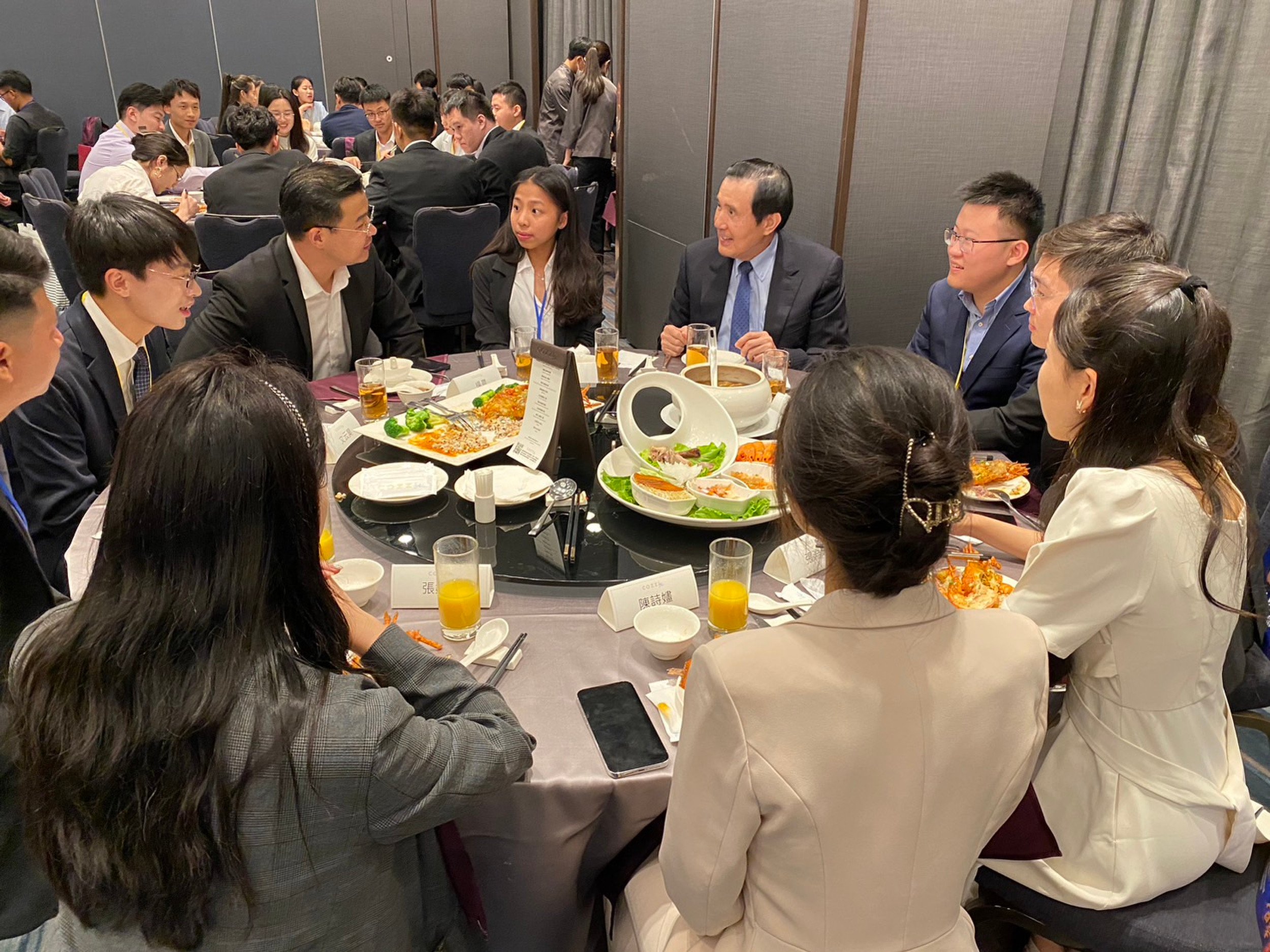 Former Taiwanese leader Ma Ying-jeou (blue tie) hosts a banquet for a visiting mainland Chinese student delegation, in Taipei in July 2023. Photo: Handout