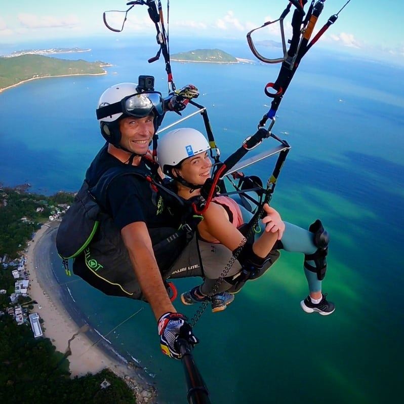 Emil Kaminski (left), the chief pilot at Hong Kong Hike ‘N’ Fly, a tandem paragliding operator, poses for a photo as he takes a person paragliding. Photo: Emil Kaminski