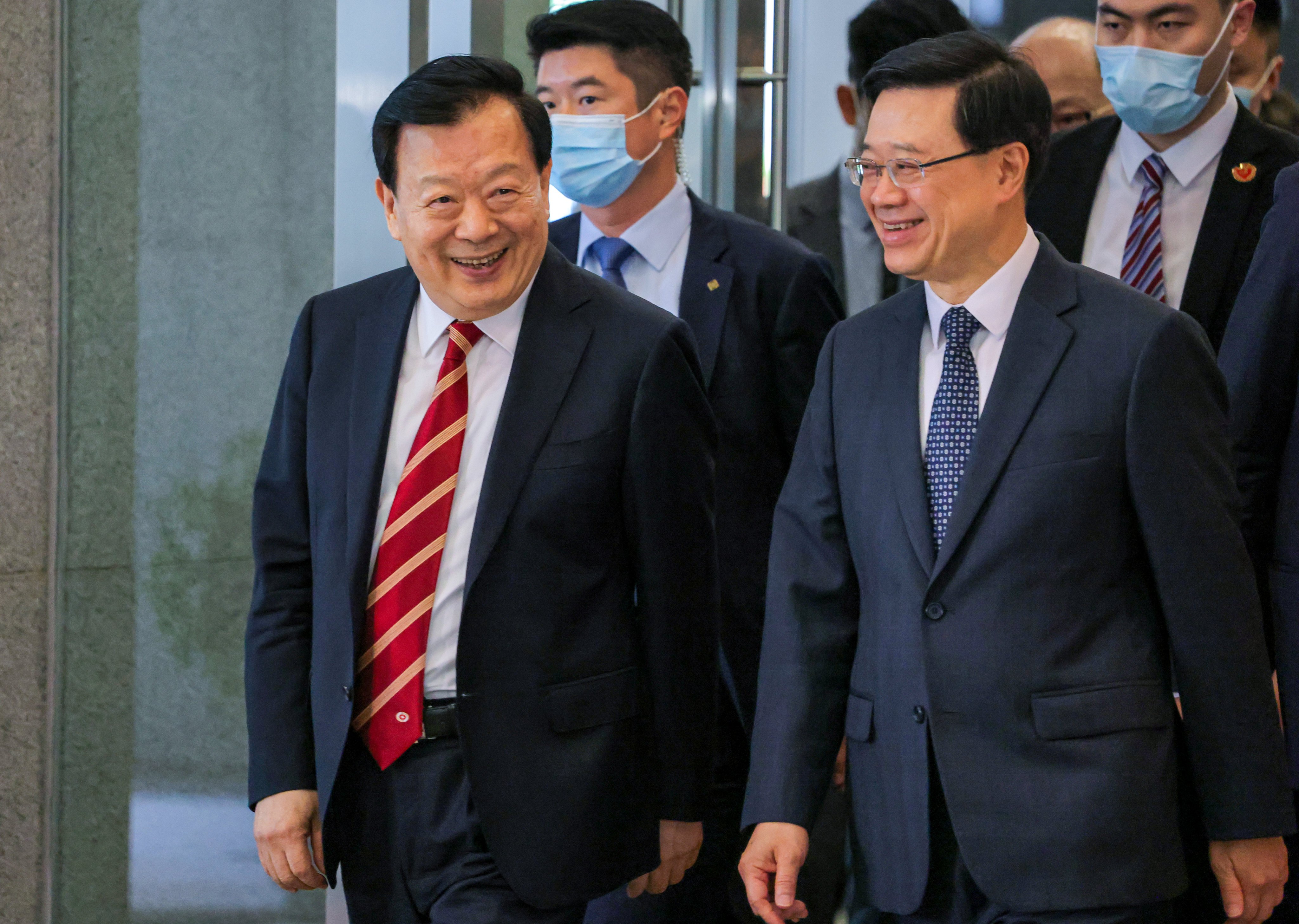 Xia Baolong (left), director of the Hong Kong and Macau Affairs Office, has made the economy a focus in recent meetings with local political and business heavyweights.  Photo: Jelly Tse