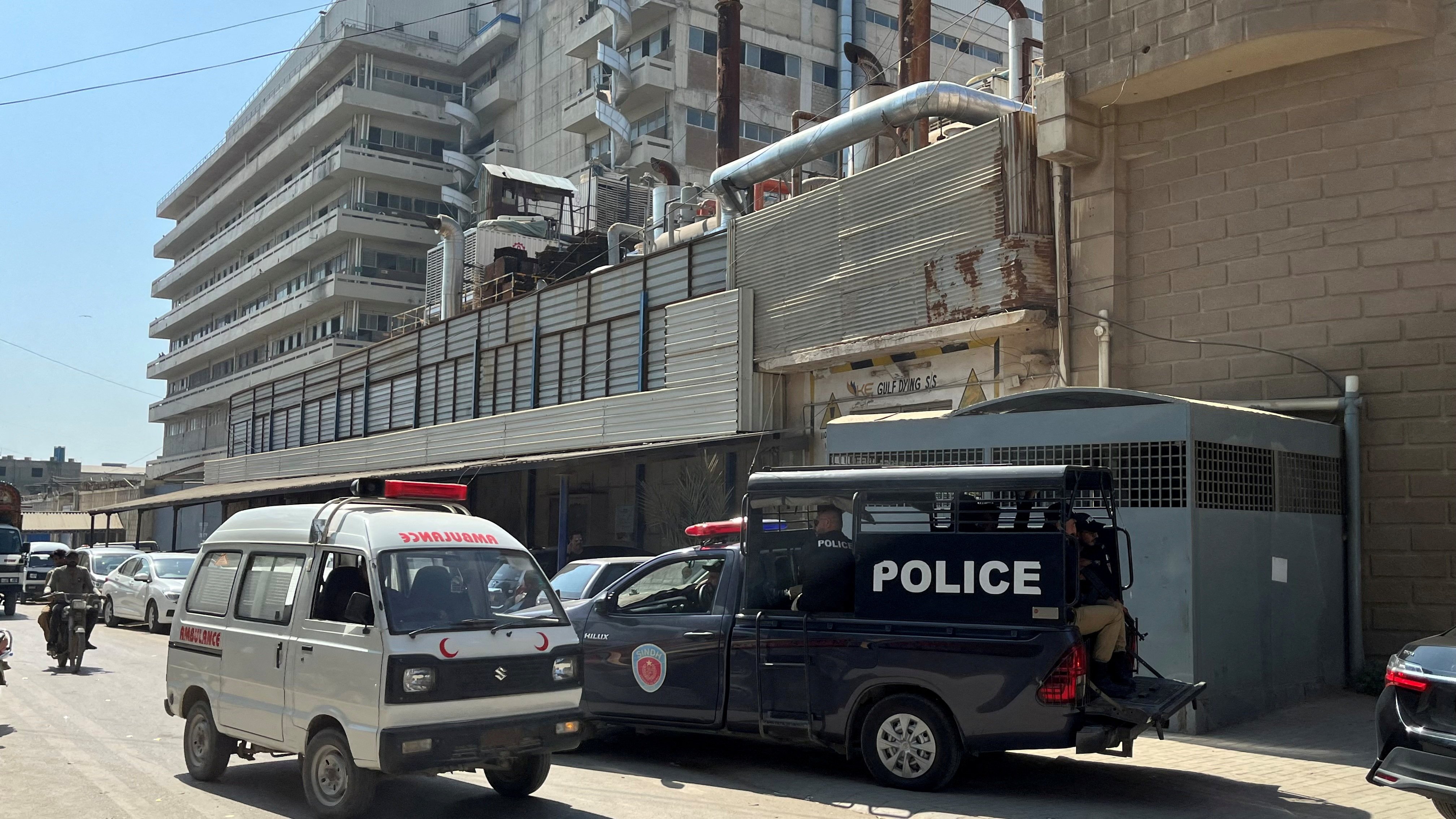 A view of a police mobile and an ambulance outside a factory where, according to police, two Chinese nationals were shot at and injured, in Karachi, Pakistan on November 5. Photo: Reuters