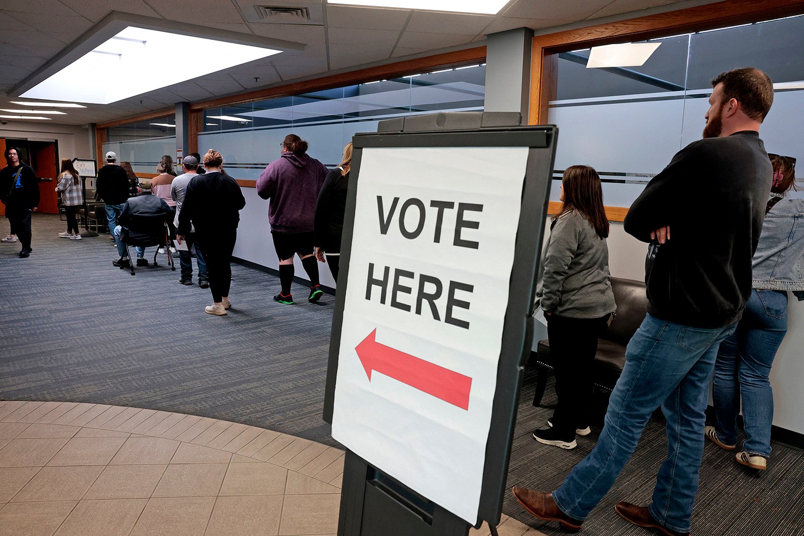 Voters wait in line to cast their ballots in Howell, Michigan, on Sunday, the last day of early voting in the state for the general election. Photo: AFP via Getty Images/TNS