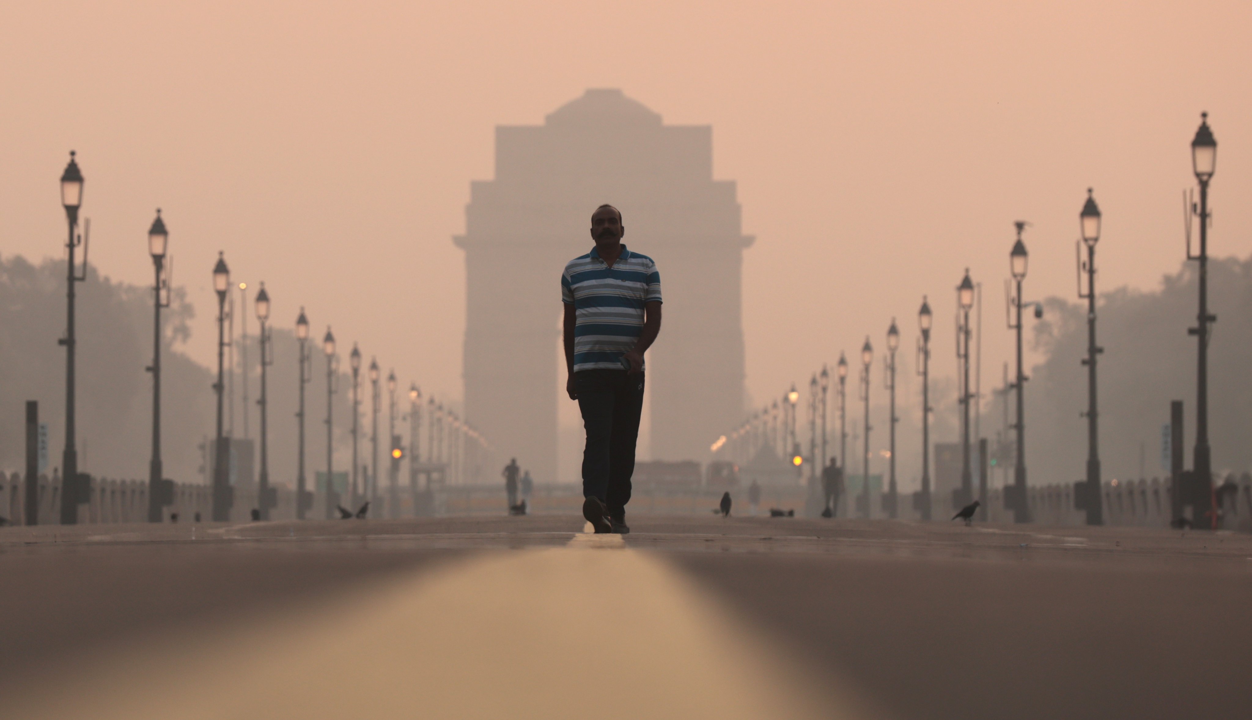 A man walks amid heavy smog in New Delhi on Friday. Officials said on Tuesday that air quality in the Indian capital was likely to be ‘very poor’ or ‘severe’ all week. Photo: EPA-EFE