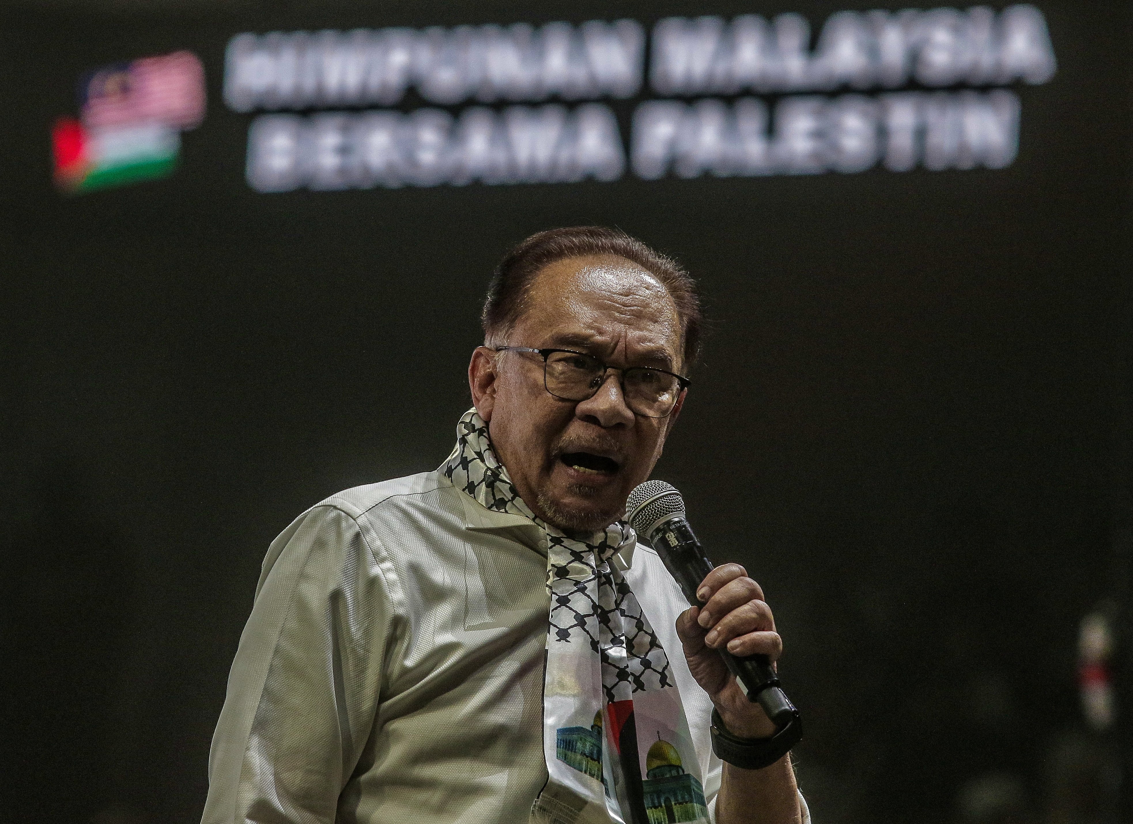 Malaysian Prime Minister Anwar Ibrahim delivers a speech to the crowd during a ‘Malaysia Stands with Palestine’ rally in Kuala Lumpur last year. Photo: EPA-EFE