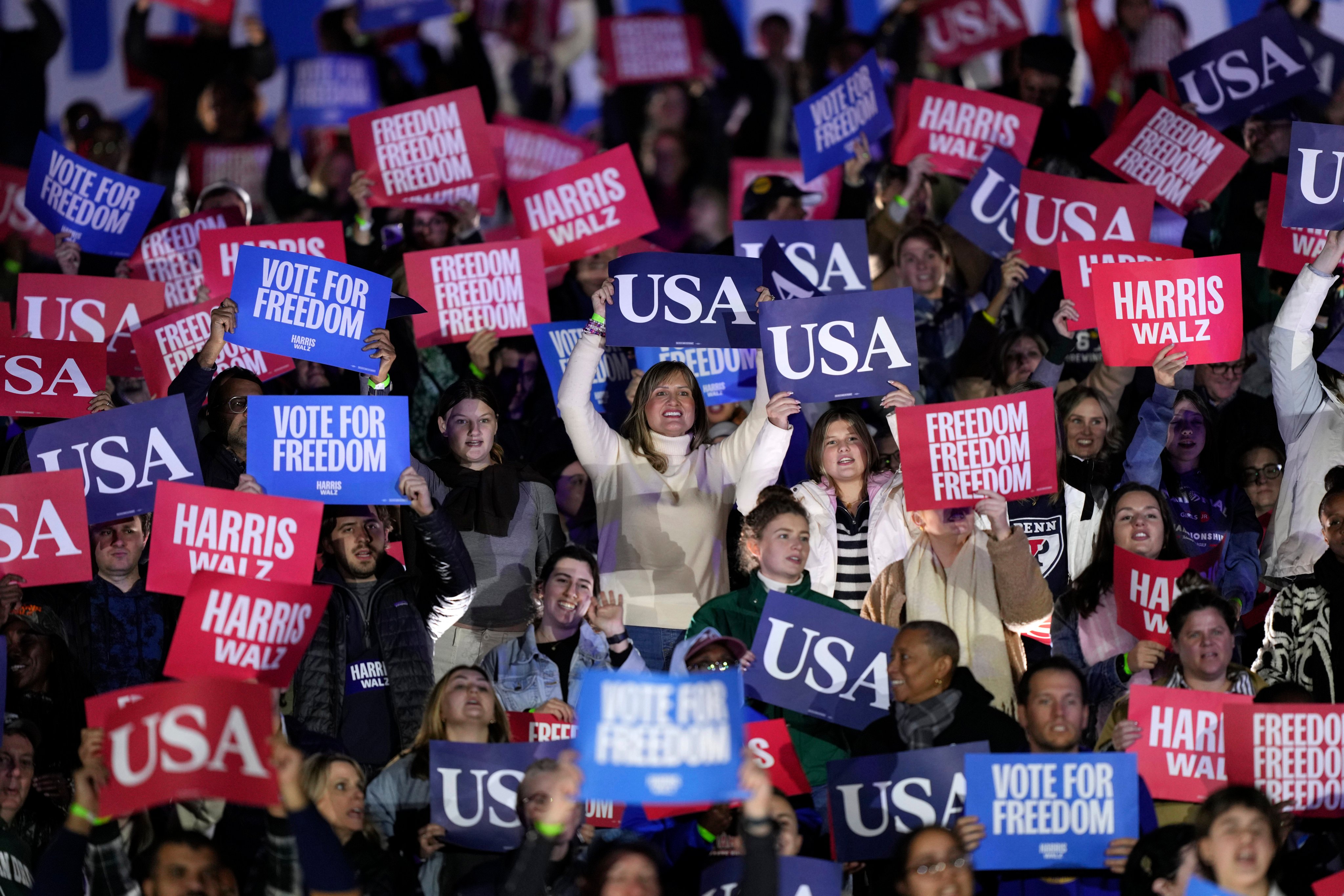 Supporters hold signs at a campaign rally for US presidential candidate Kamala Harris in Philadelphia, Pennsylvania on Monday. Photo: AP