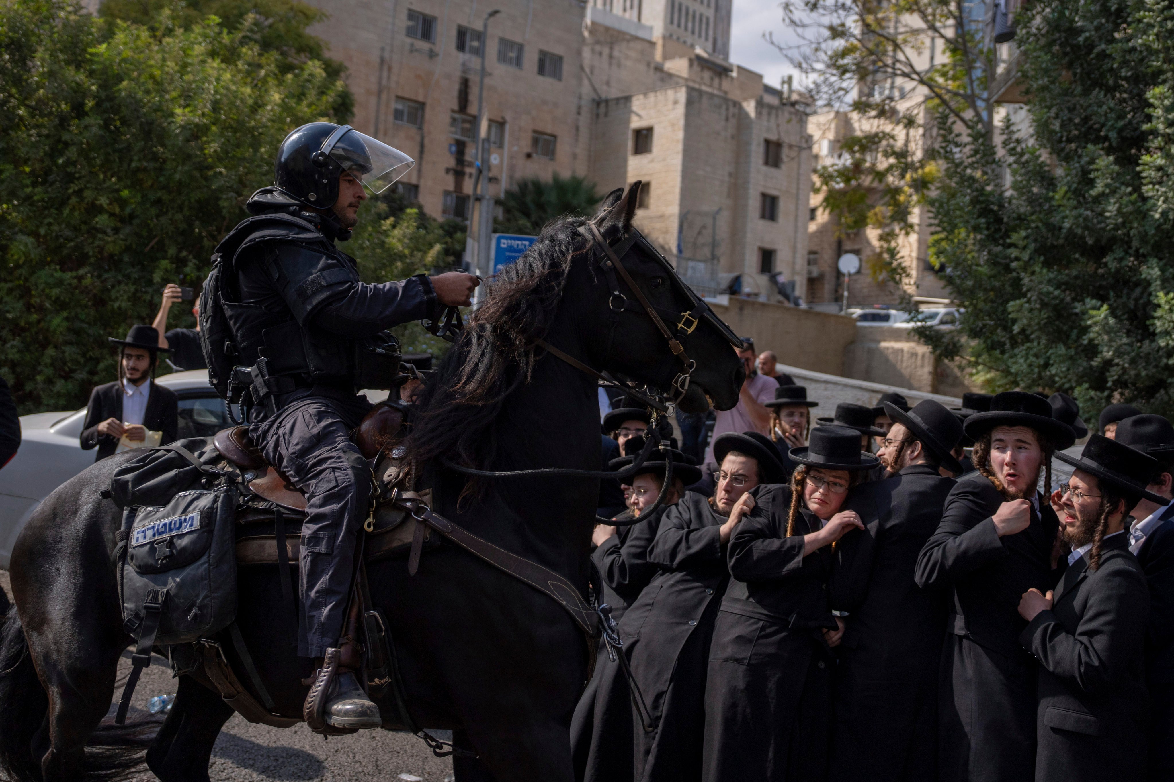 Israeli police scuffle with ultra-Orthodox Jewish men in Jerusalem on Thursday. Photo: AP