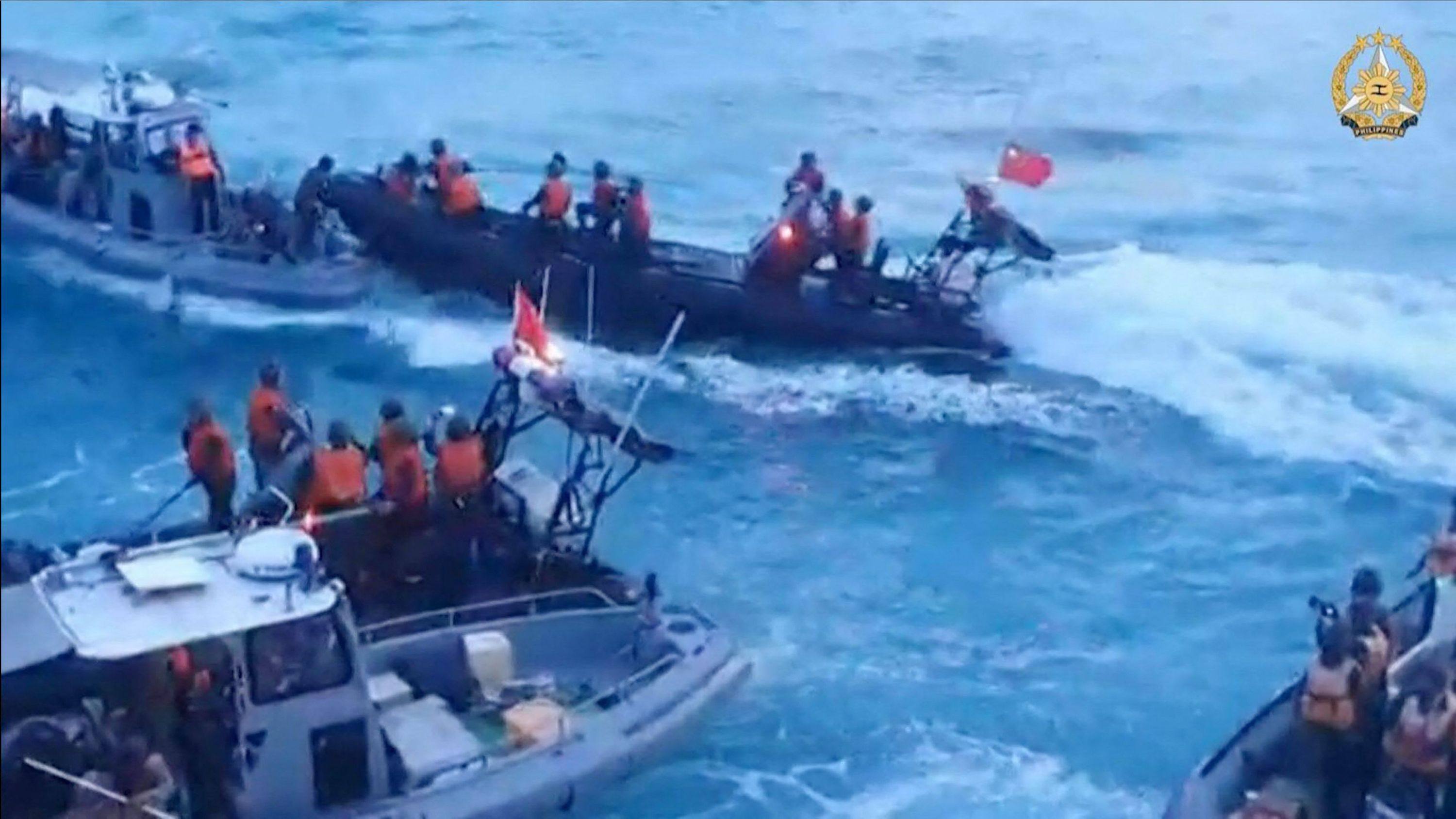 Chinese coastguard personnel during a confrontation with the Philippine navy in the disputed South China Sea in June. Photo: AFP
