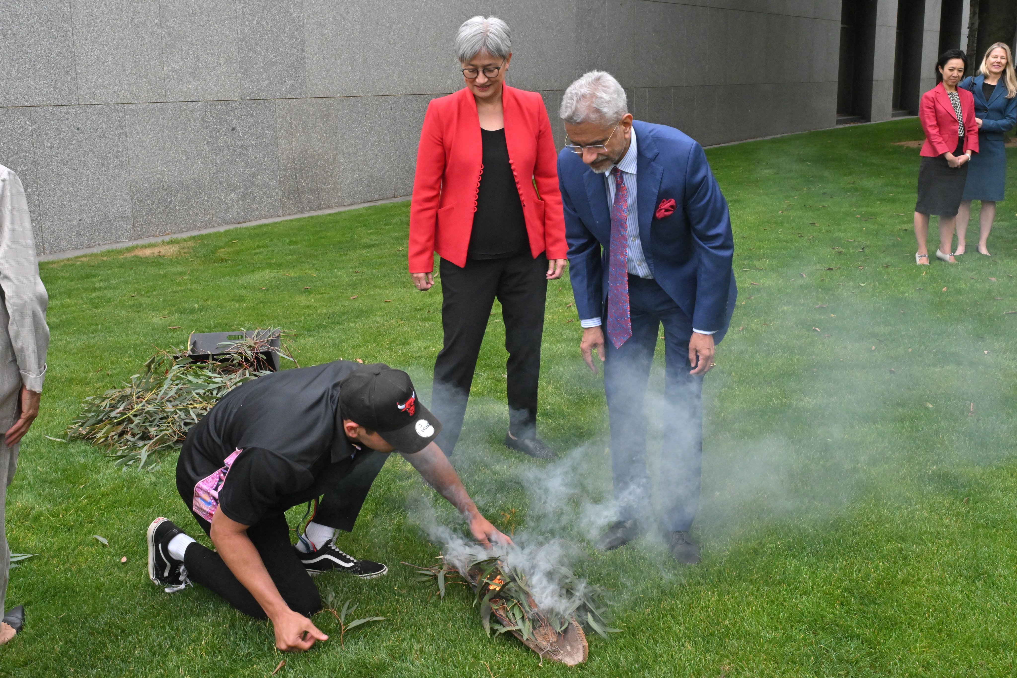 India’s External Affairs Minister S. Jaishankar attends a smoking ceremony at Parliament House in Canberra on Tuesday with Australia’s Foreign Affairs Minister Penny Wong. Photo: EPA-EFE