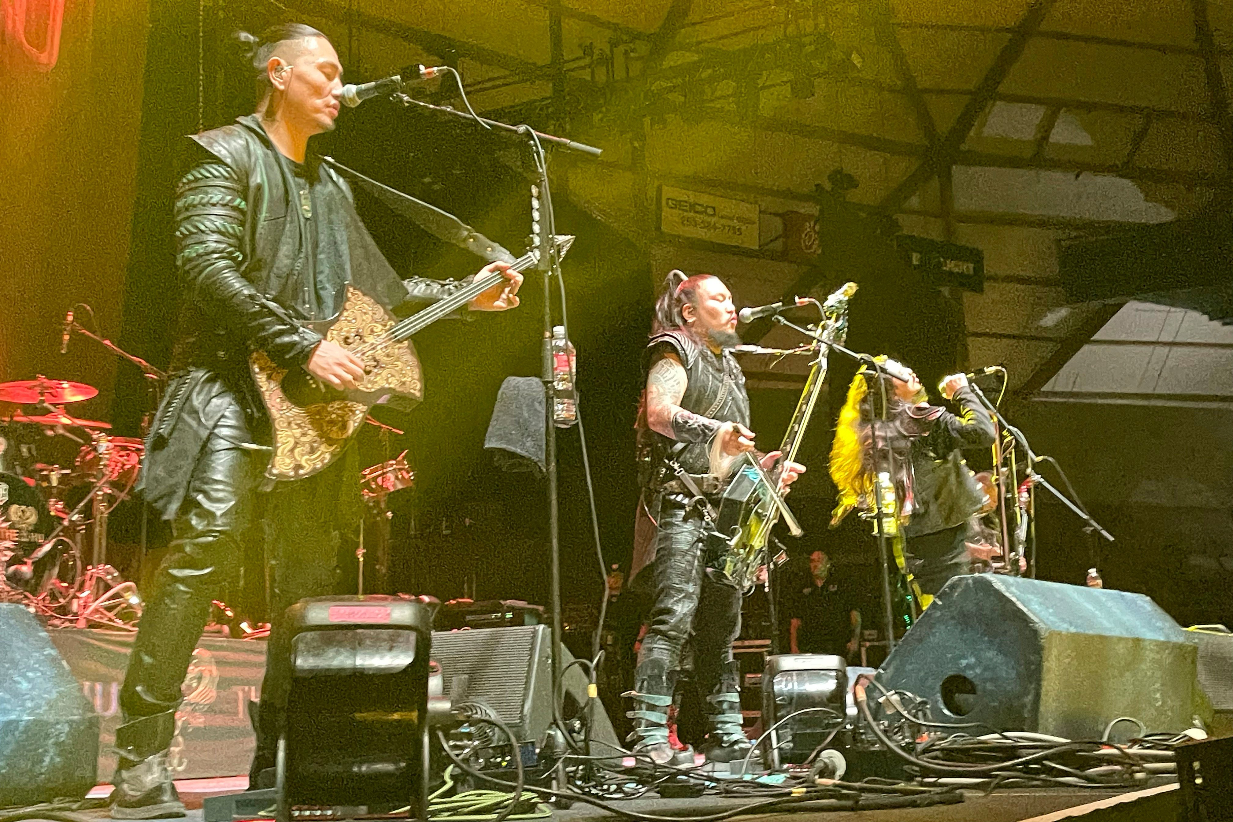 (From left) Temuulen “Temka” Naranbaatar, Galbadrakh “Gala” Tsendbaatar and Nyamjantsan “Jaya” Galsanjamts of The Hu perform with the rest of the Mongolian heavy metal band at the Tacoma Dome in the US state of Washington on October 16, 2024. Photo: AP