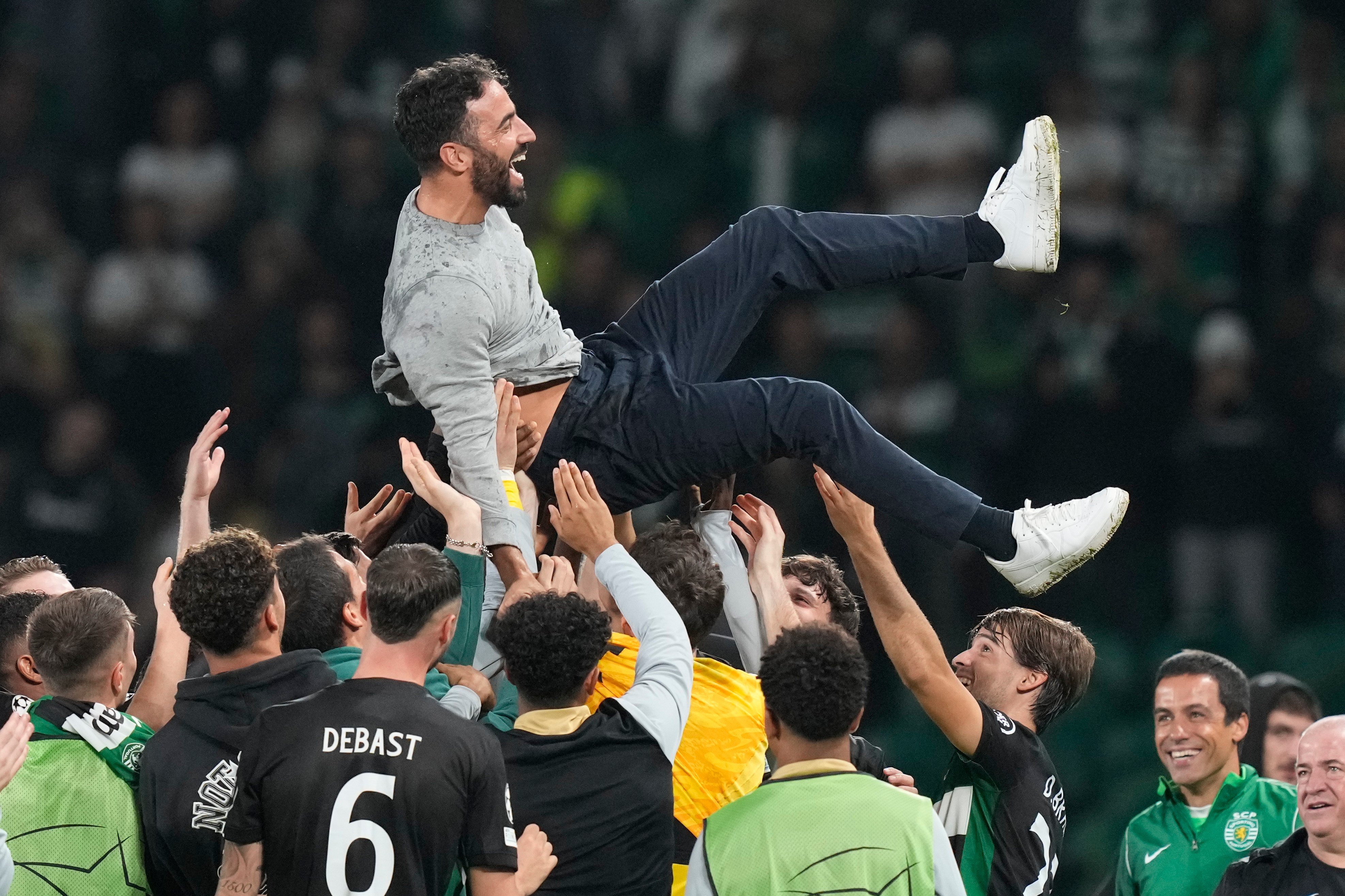 Sporting players toss coach Ruben Amorim in the air to celebrate their historic 4-1 victory over Manchester City in his final home match in charge. Photo: AP