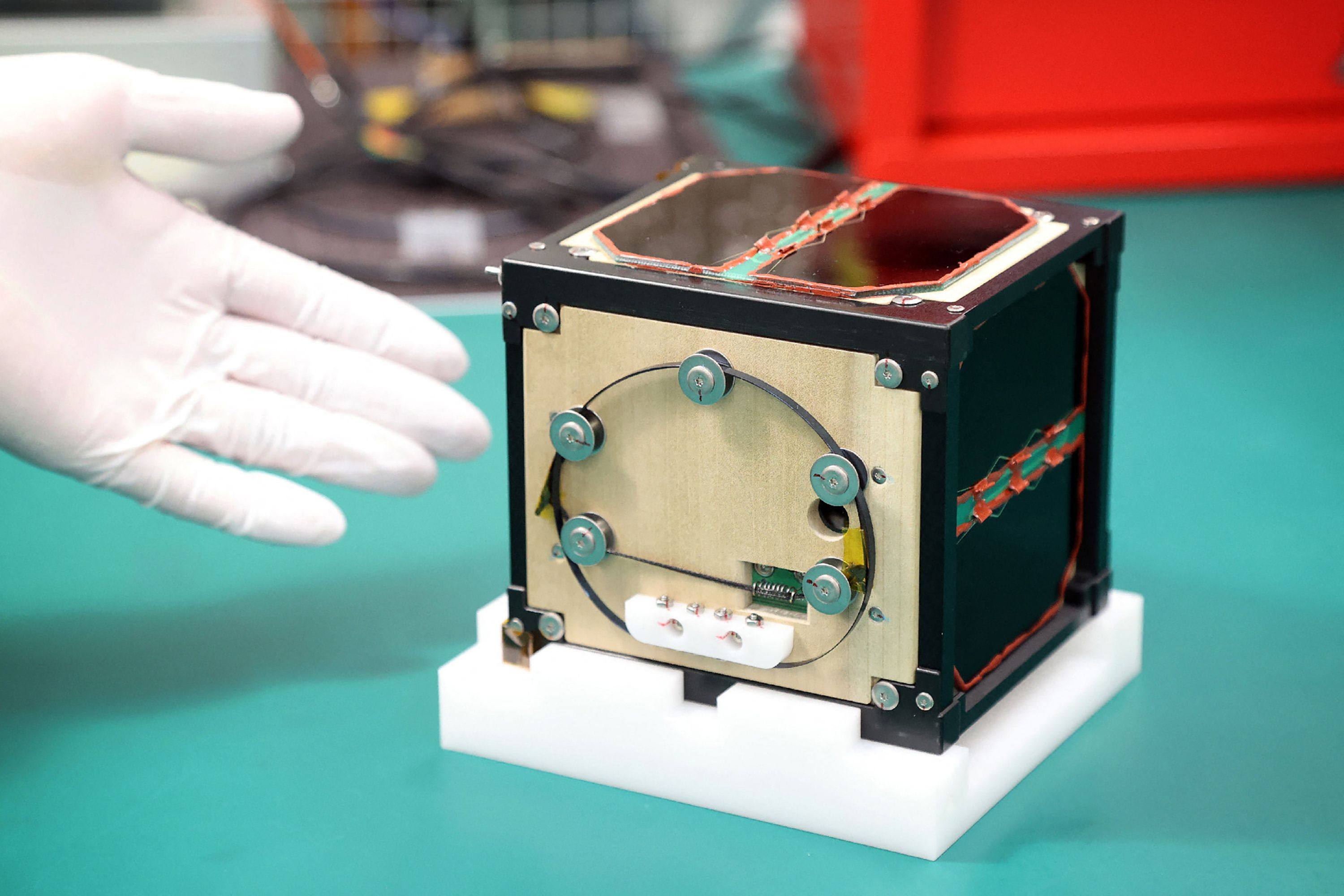 LignoSat, the world’s first satellite made from wood, developed by scientists at Kyoto University in Japan and logging company Sumitomo Forestry. Photo: Jiji Press/AFP