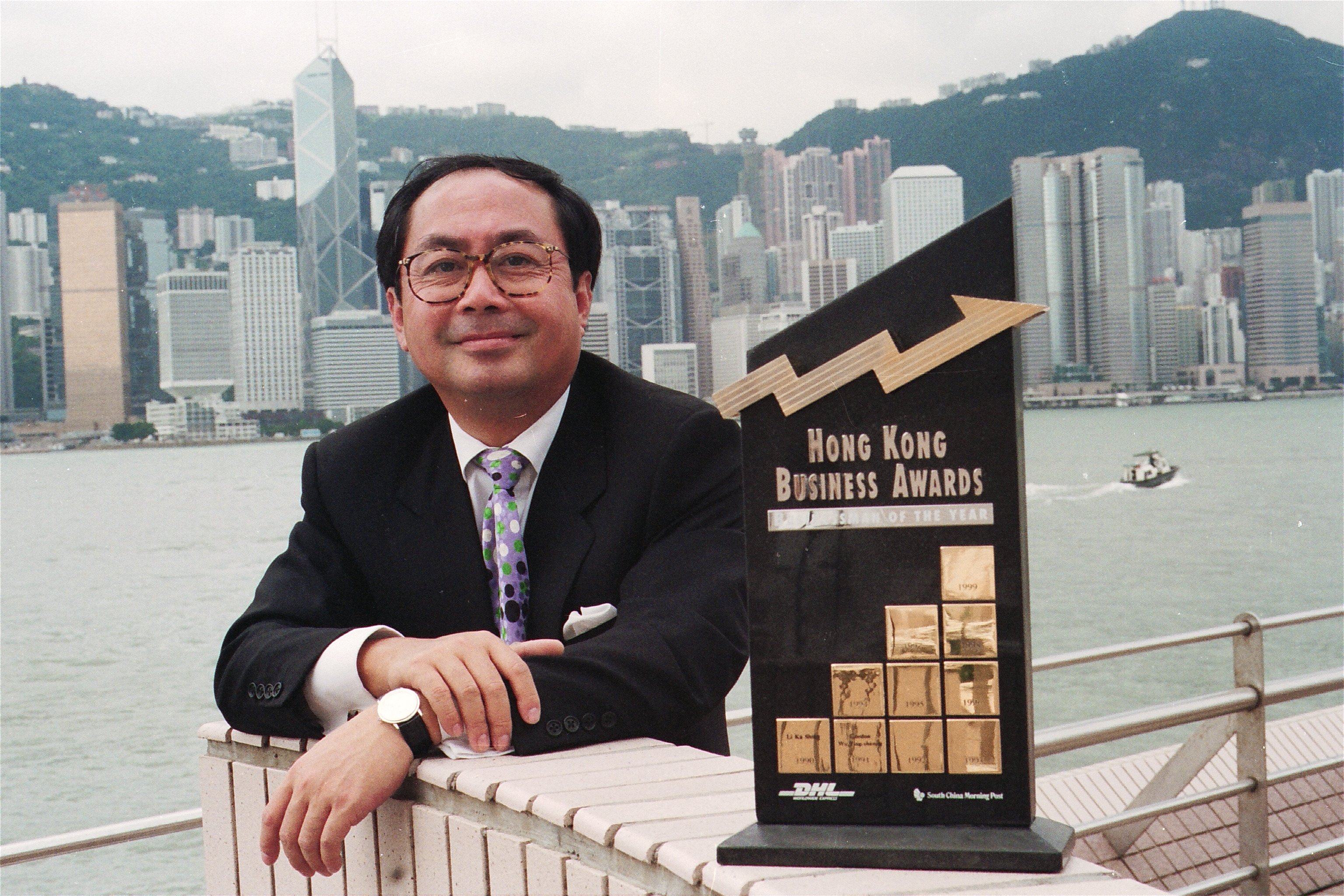 Po Chung, then chairman of DHL International, with the Hong Kong Business Awards trophy the company won in 1992. Photo: SCMP Pictures