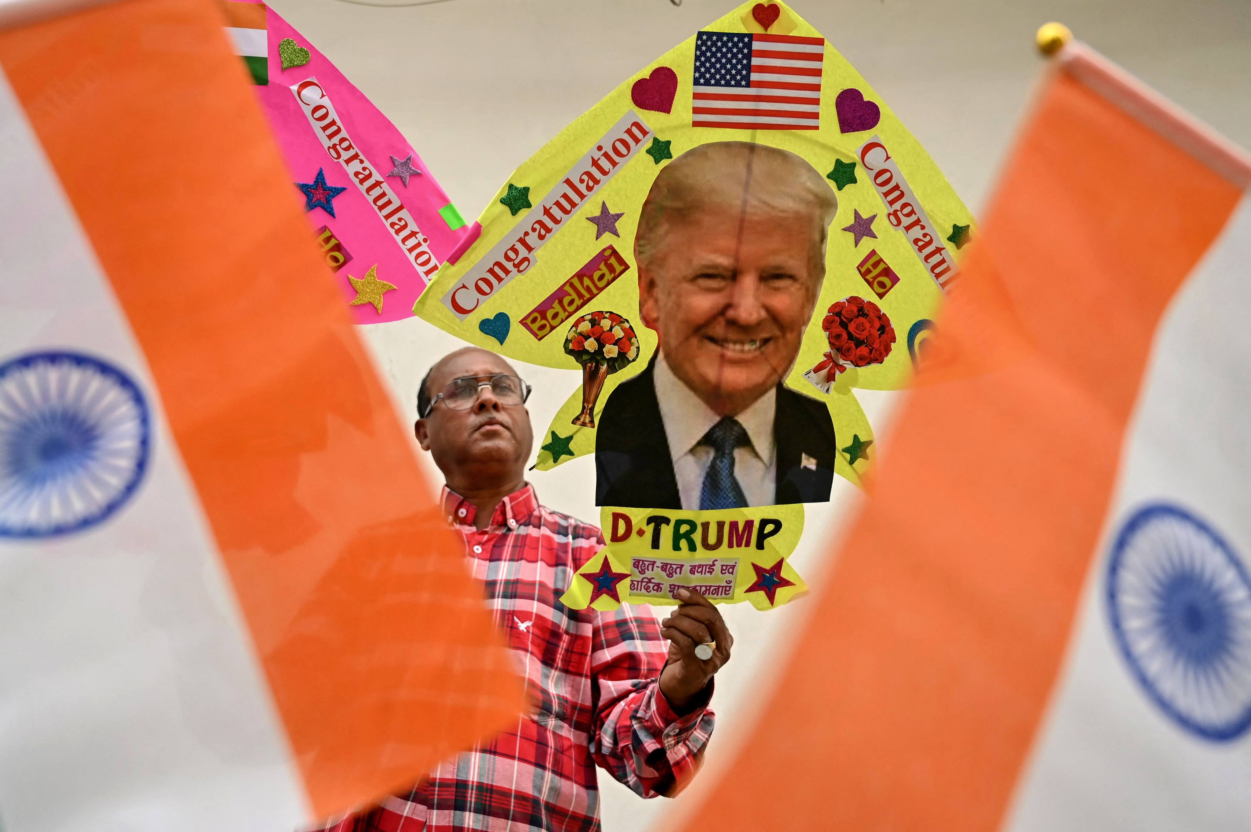 A kitemaker displays a kite decorated with an image of former US president and Republican presidential candidate Donald Trump in Amritsar, India, on Wednesday. Trump has won the US presidential election, according to US media. Photo: AFP