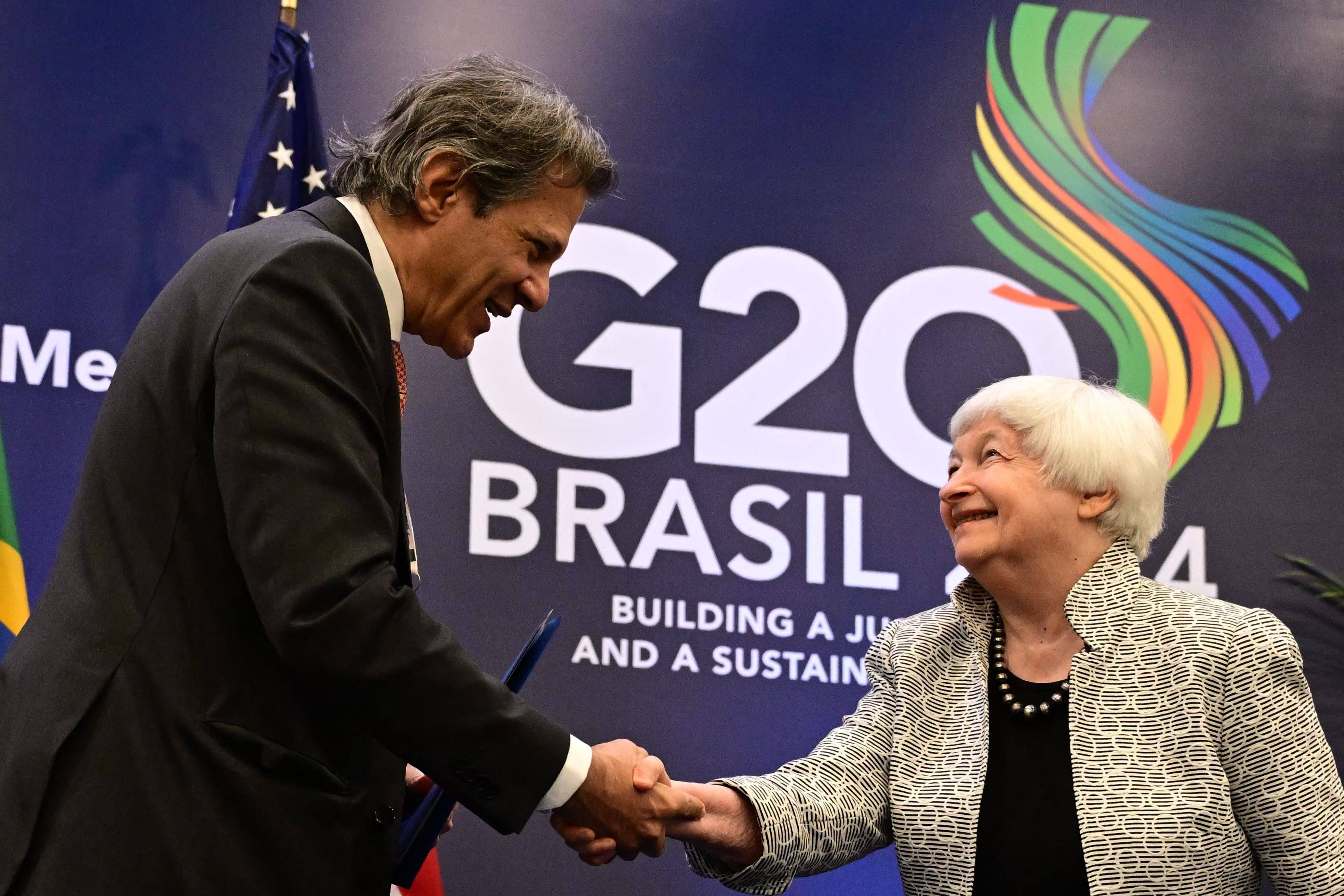 Brazil’s Economy Minister Fernando Haddad shakes hands with US Treasury Secretary Janet Yellen during the G20 economic ministers’ meeting in Rio de Janeiro, Brazil, on July 26. The G20 summit is scheduled for November 18-19. Photo: AFP