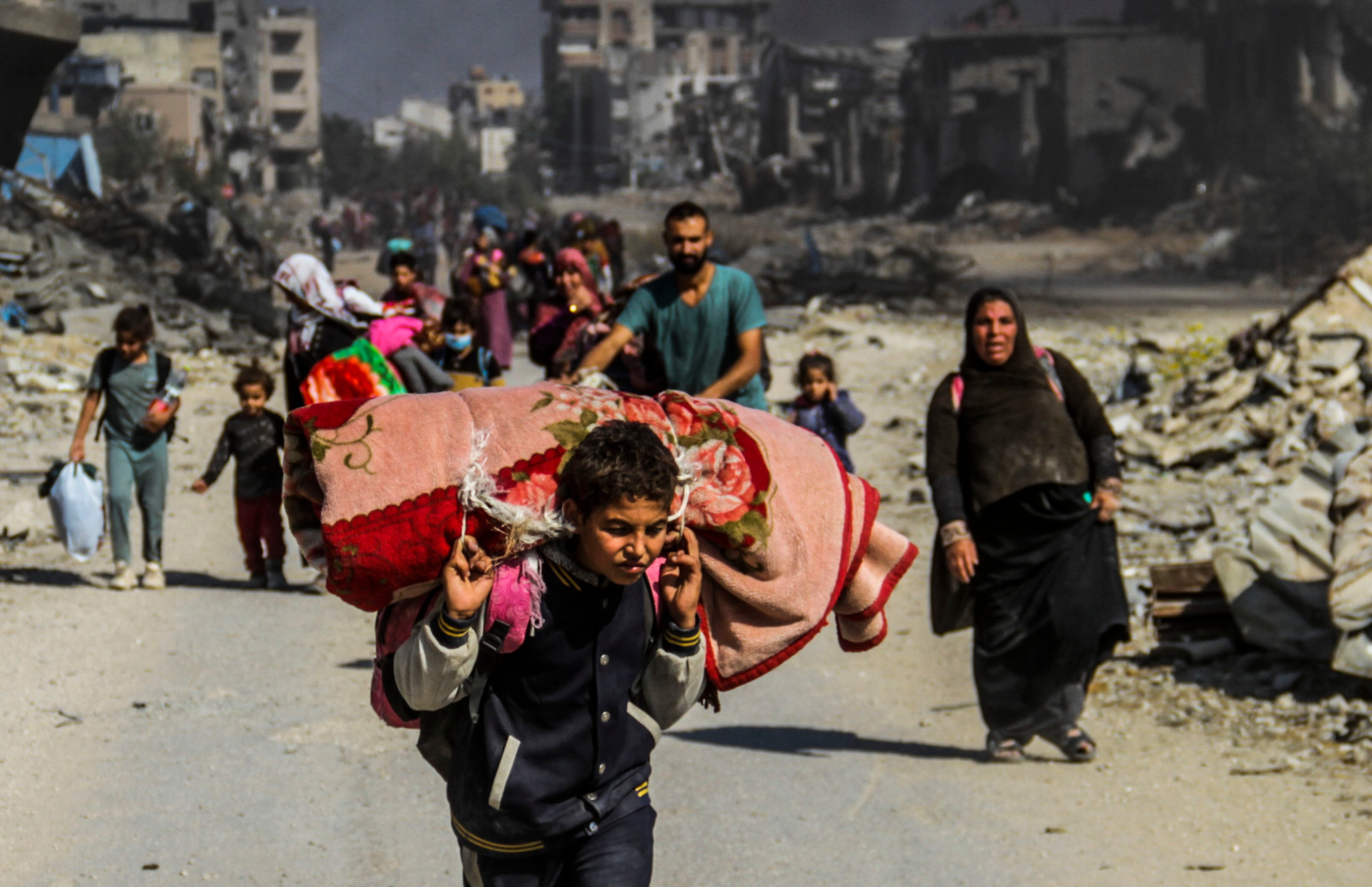 Palestinians flee Beit Lahia in the northern Gaza Strip on Tuesday after an Israeli bombardment killed at least 25 people. Photo: Xinhua