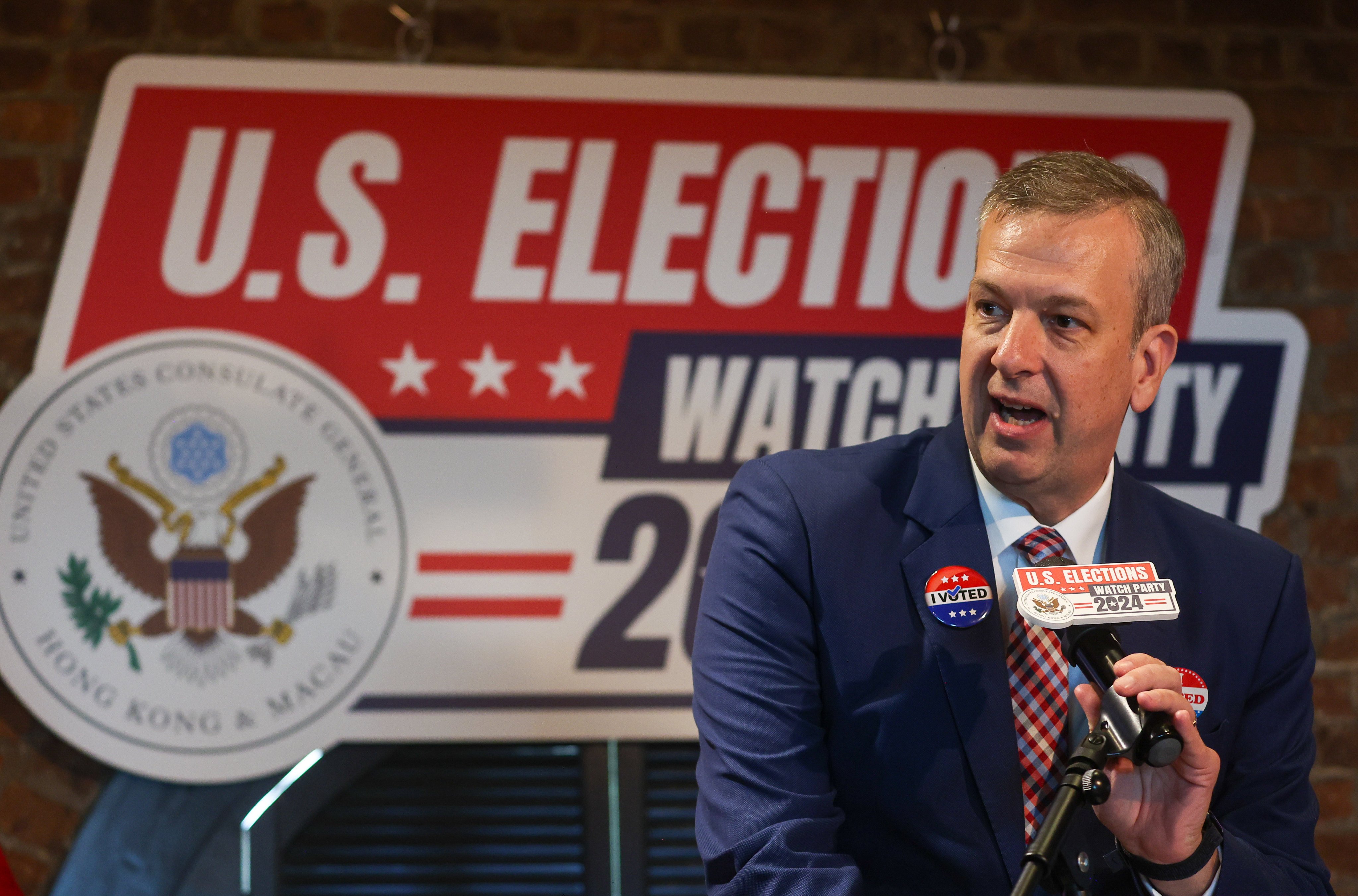 Diplomat Gregory May speaks to reporters at a US election watch party in Central. Photo: Edmond So