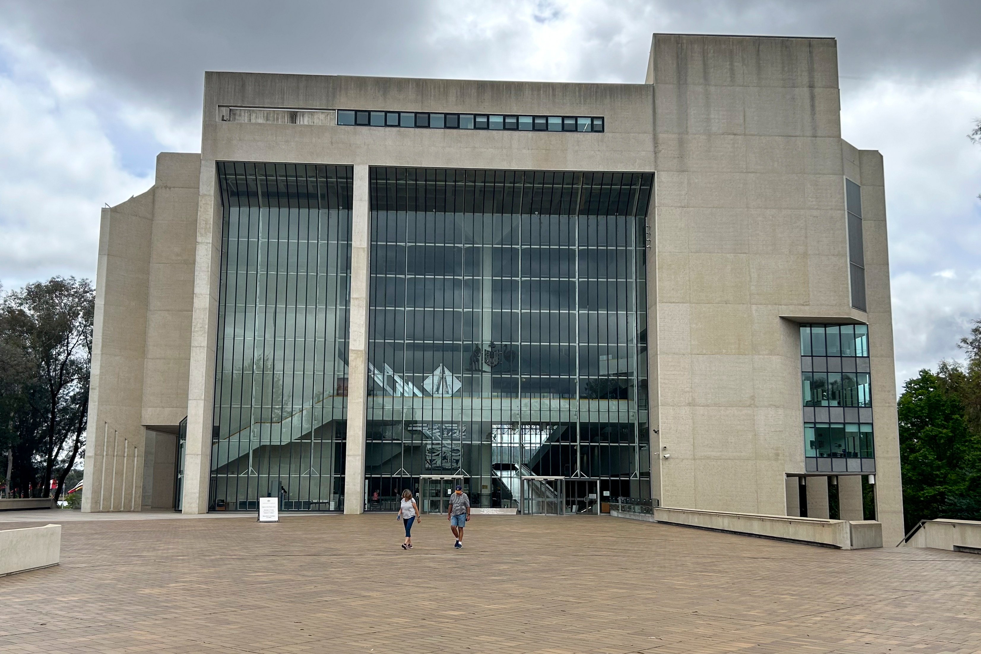 People walk outside the High Court building in Canberra, Australia. Photo: AP