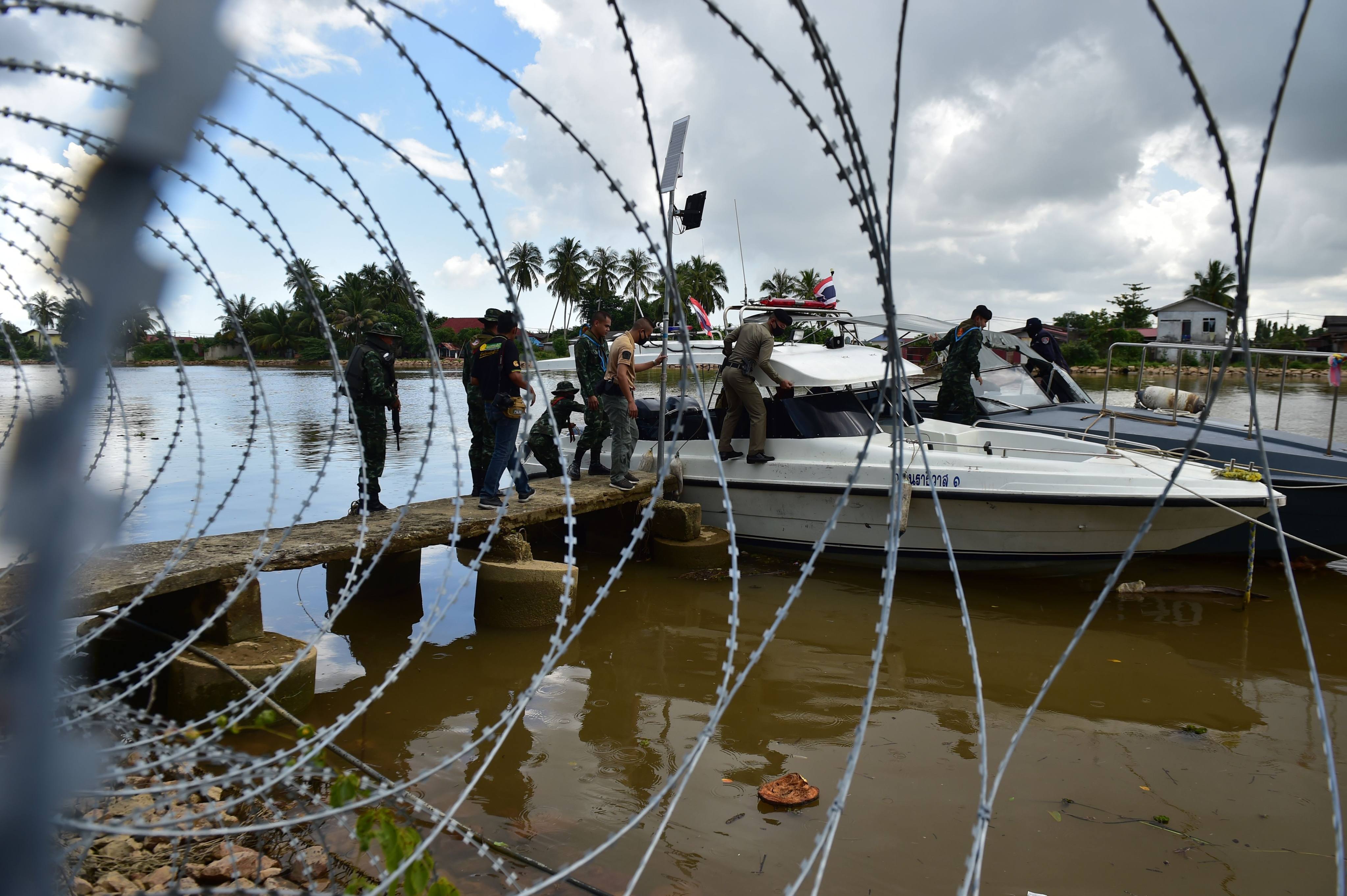 Thai security forces take part in a joint police and army river patrol along the Thailand-Malaysia border in the southern province of Narathiwat to prevent illegal entries. Photo: AFP