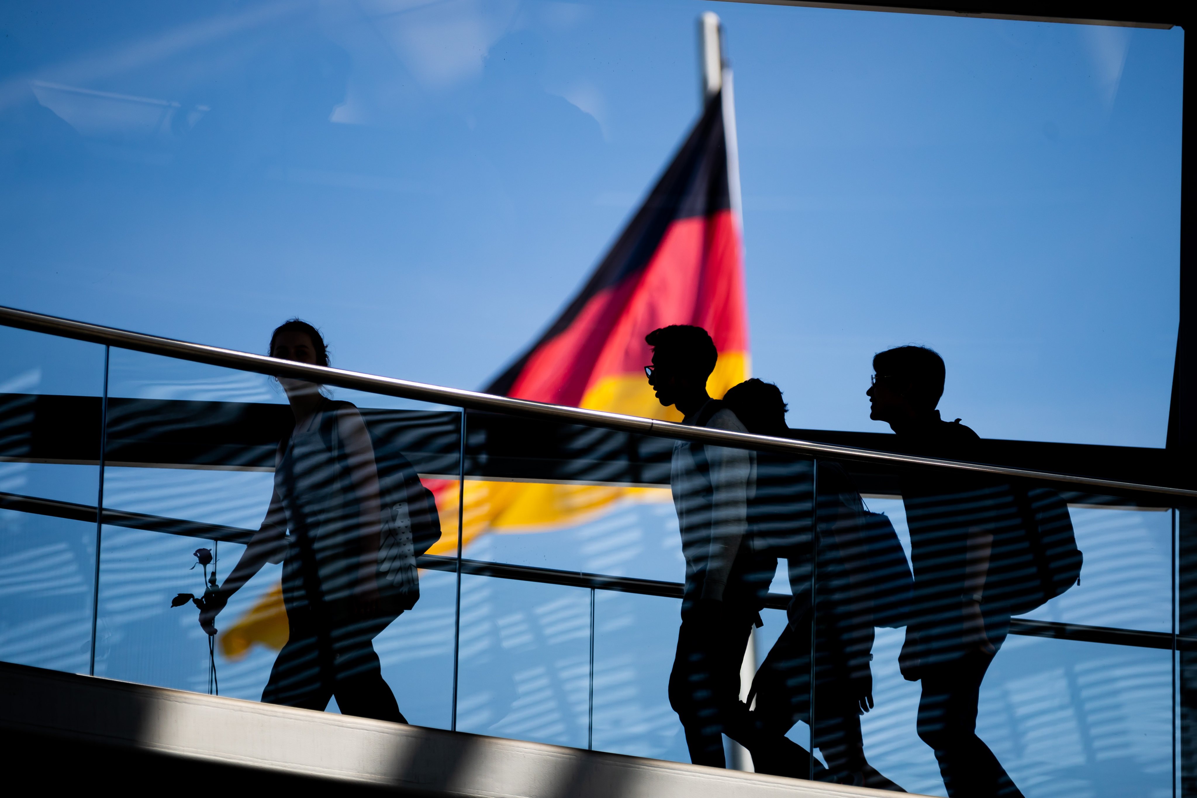 Visitors walk through the dome of the Reichstag building. German investigators have exposed several people suspected of spying for China this year. Photo: dpa