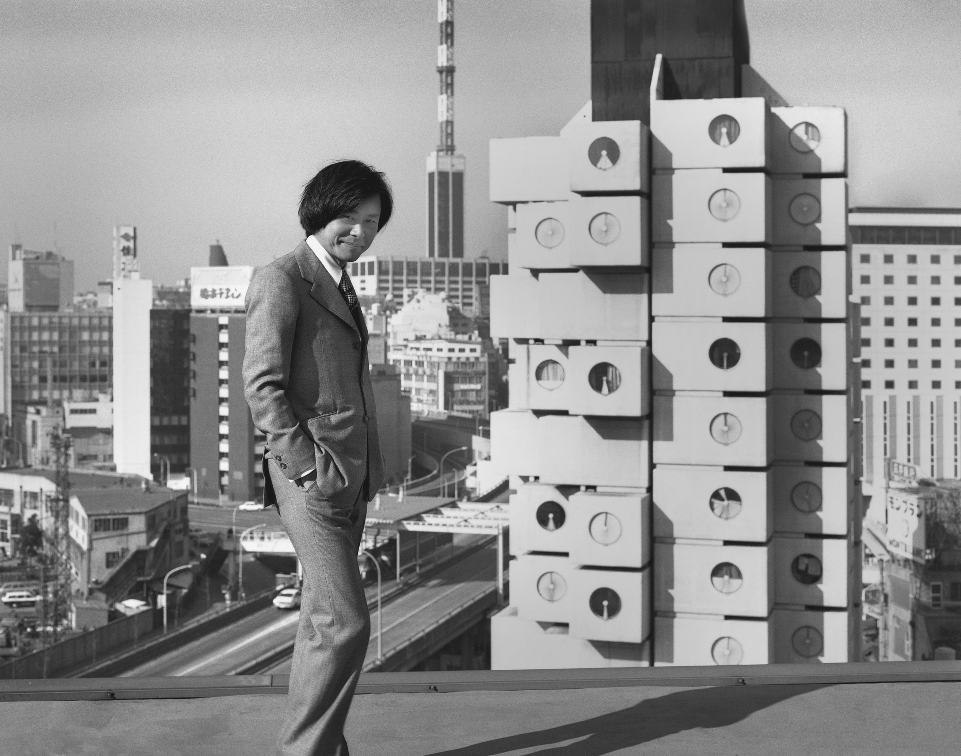 Architect Kisho Kurokawa with his creation, Japan’s Nakagin Capsule Tower, in 1972. Photo: Tomio Ohashi/M+