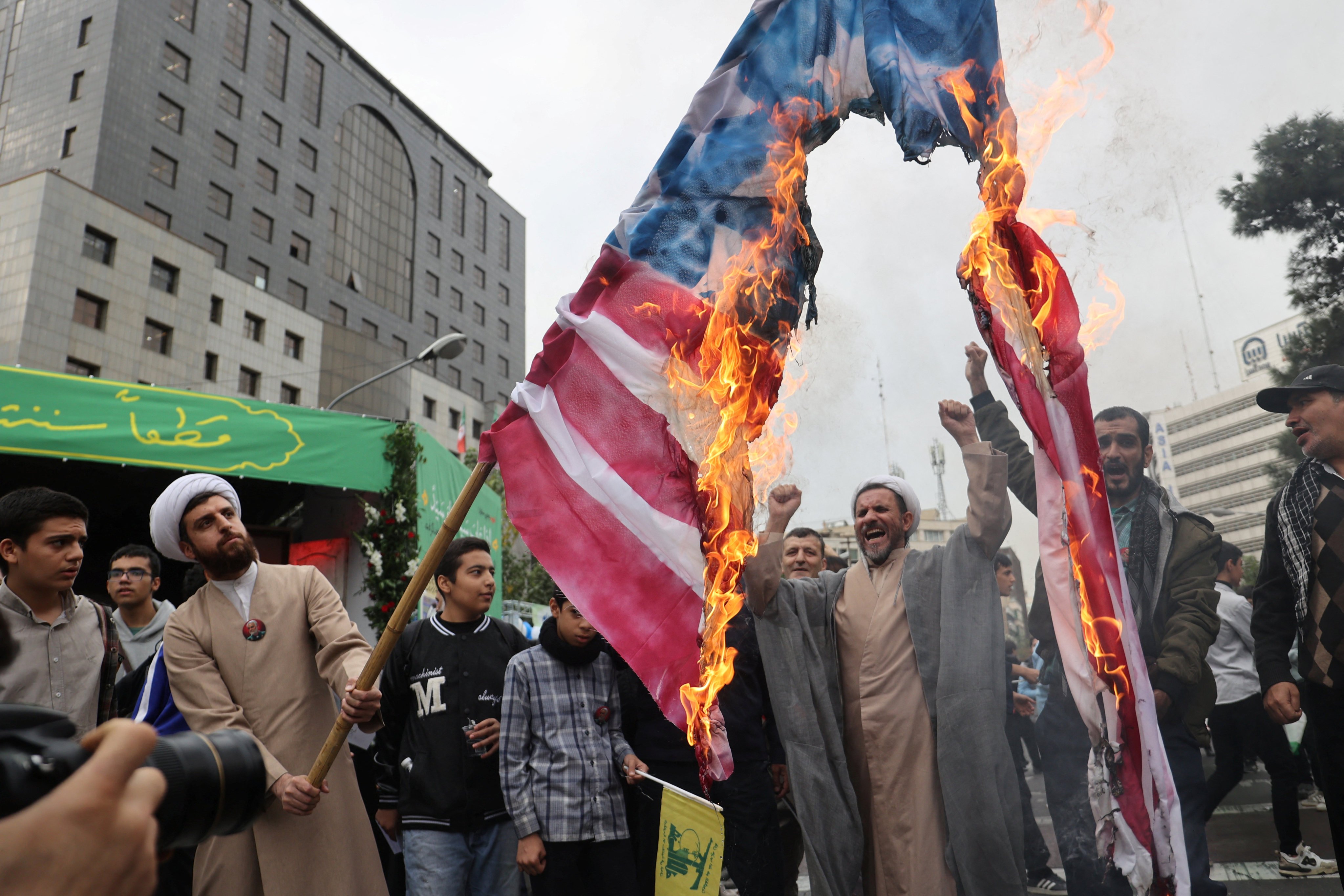 Iranians burn a US flag to mark the 45th anniversary of America’s expulsion from Iran on Sunday. Photo: West Asia News Agency via Reuters