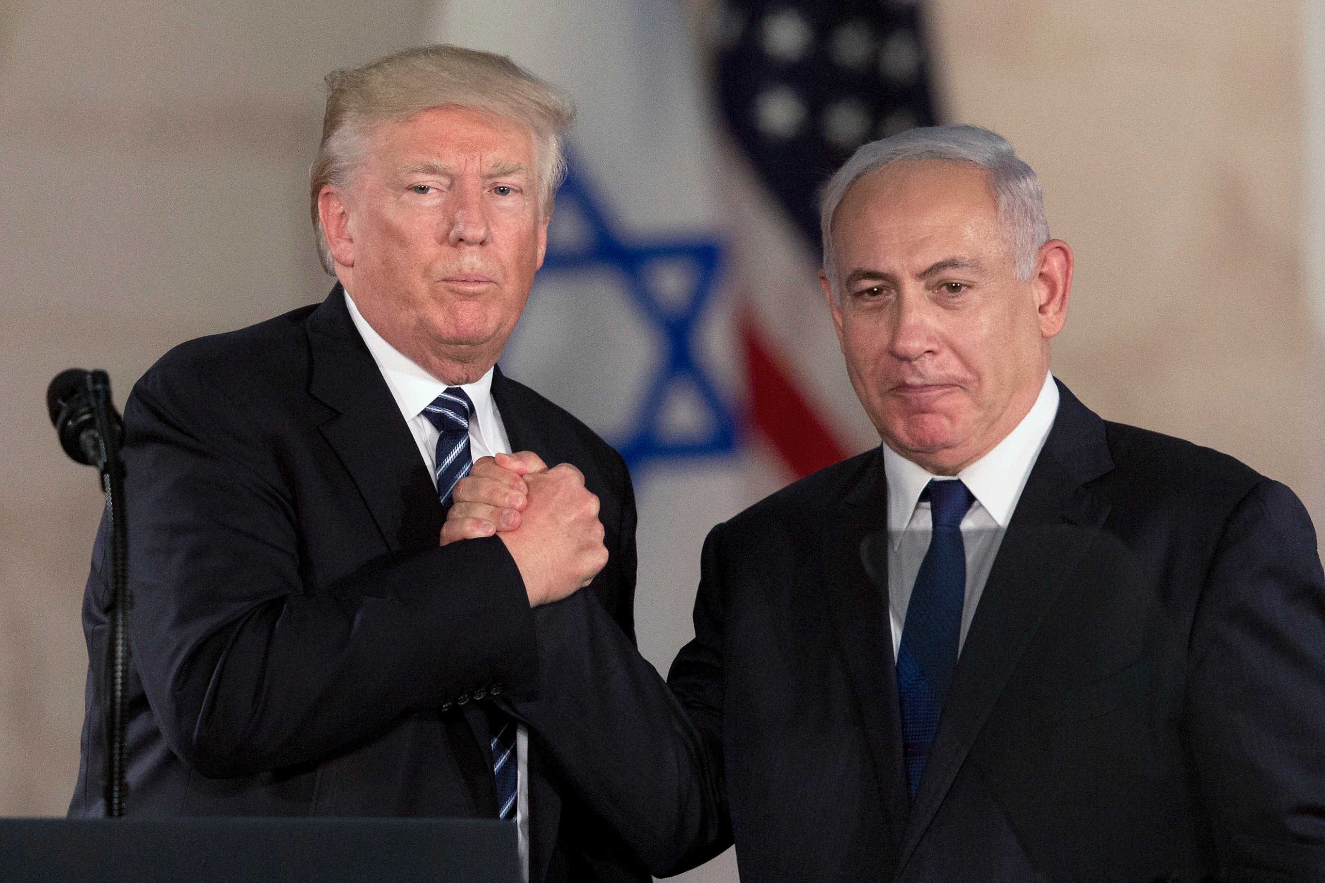 Donald Trump and Israeli Prime Minister Benjamin Netanyahu shake hands at the Israel museum in Jerusalem in May 2017. Photo: AP