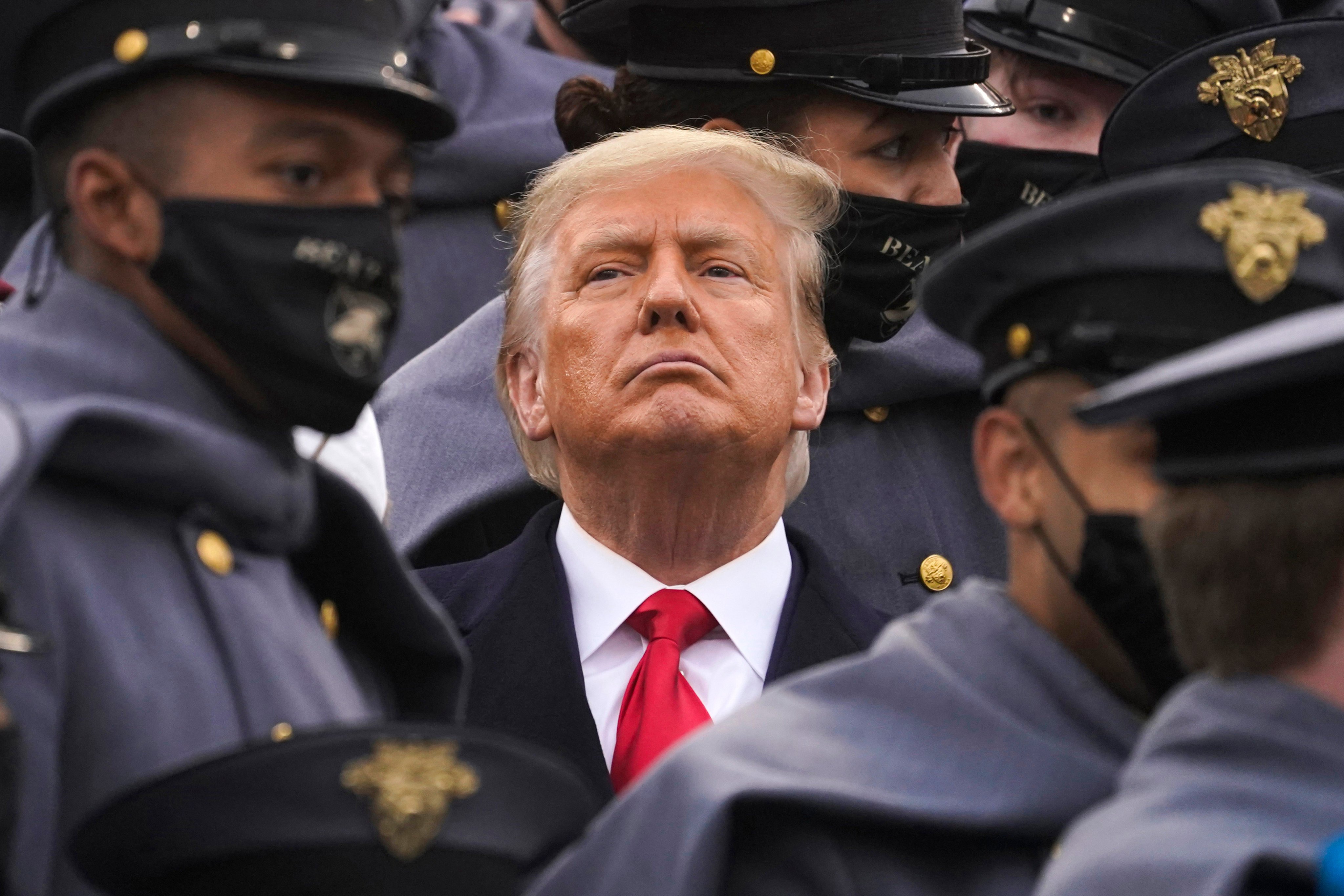 Surrounded by army cadets, Donald Trump, then US president, watches the first half of the 121st Army-Navy Game on December 12, 2020, in West Point, New York. Trump won the US presidential election this week. Photo: AP