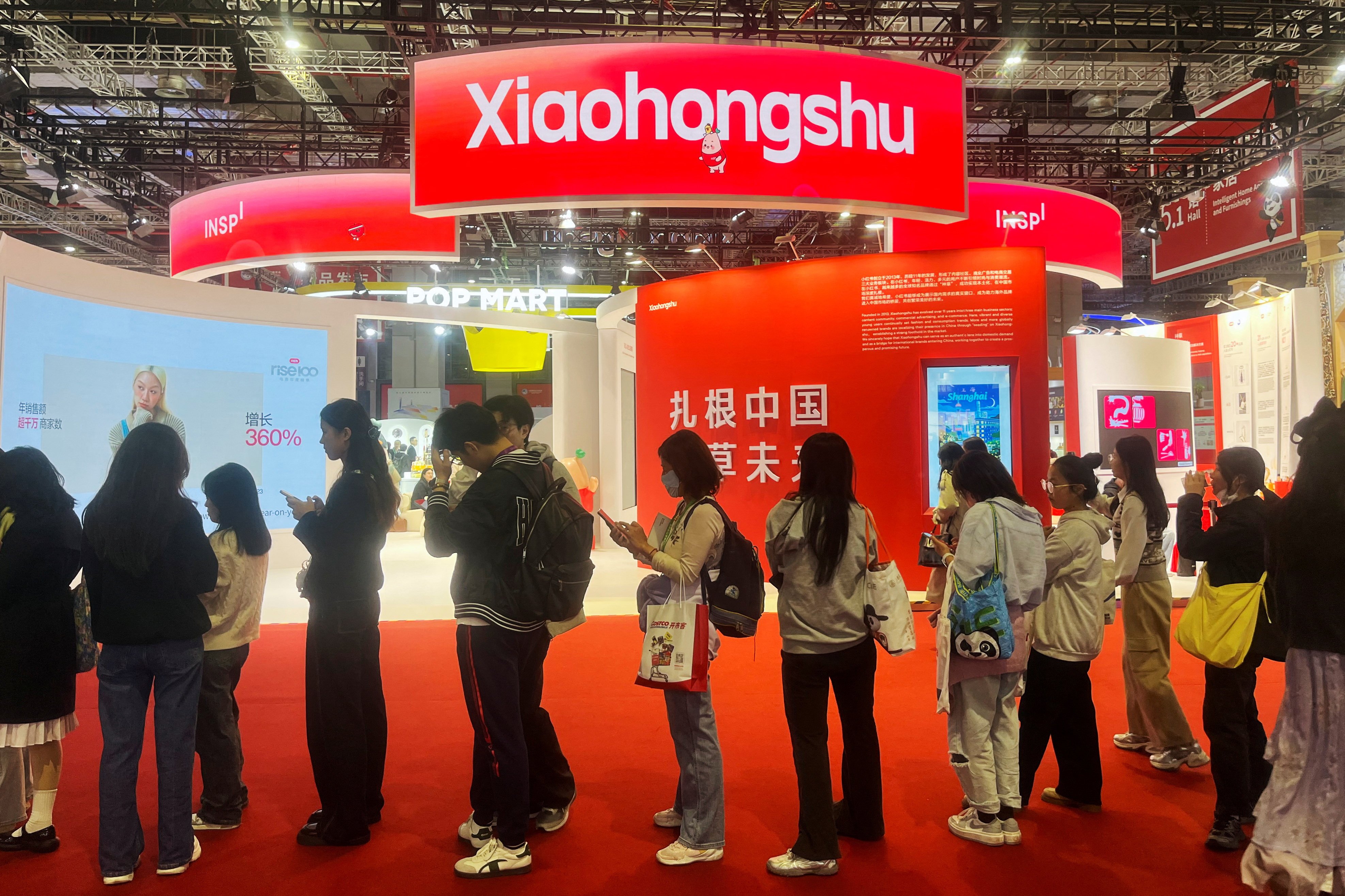 Visitors line up near the booth for Xiaohongshu at the China International Import Expo (CIIE) in Shanghai on November 6. Photo: Reuters