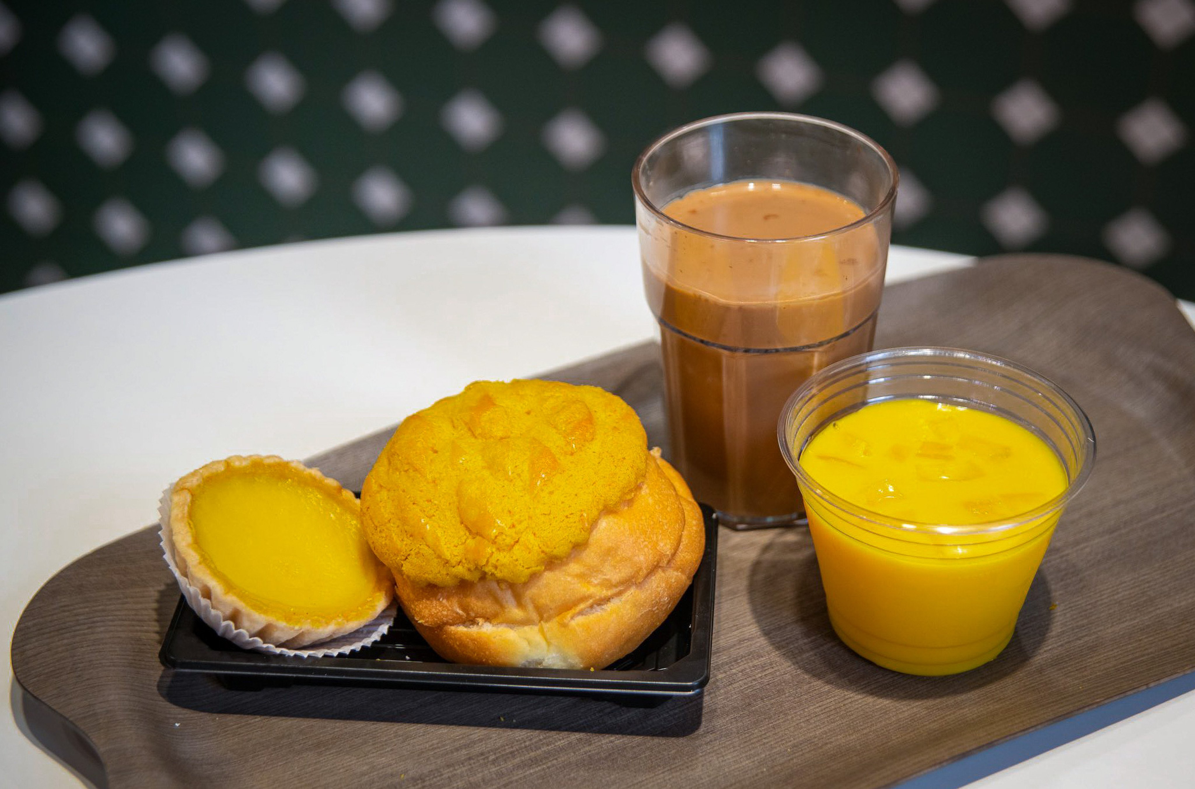 One student is eager to share Hong Kong specialities like pineapple buns with the world. Photo: HKTB