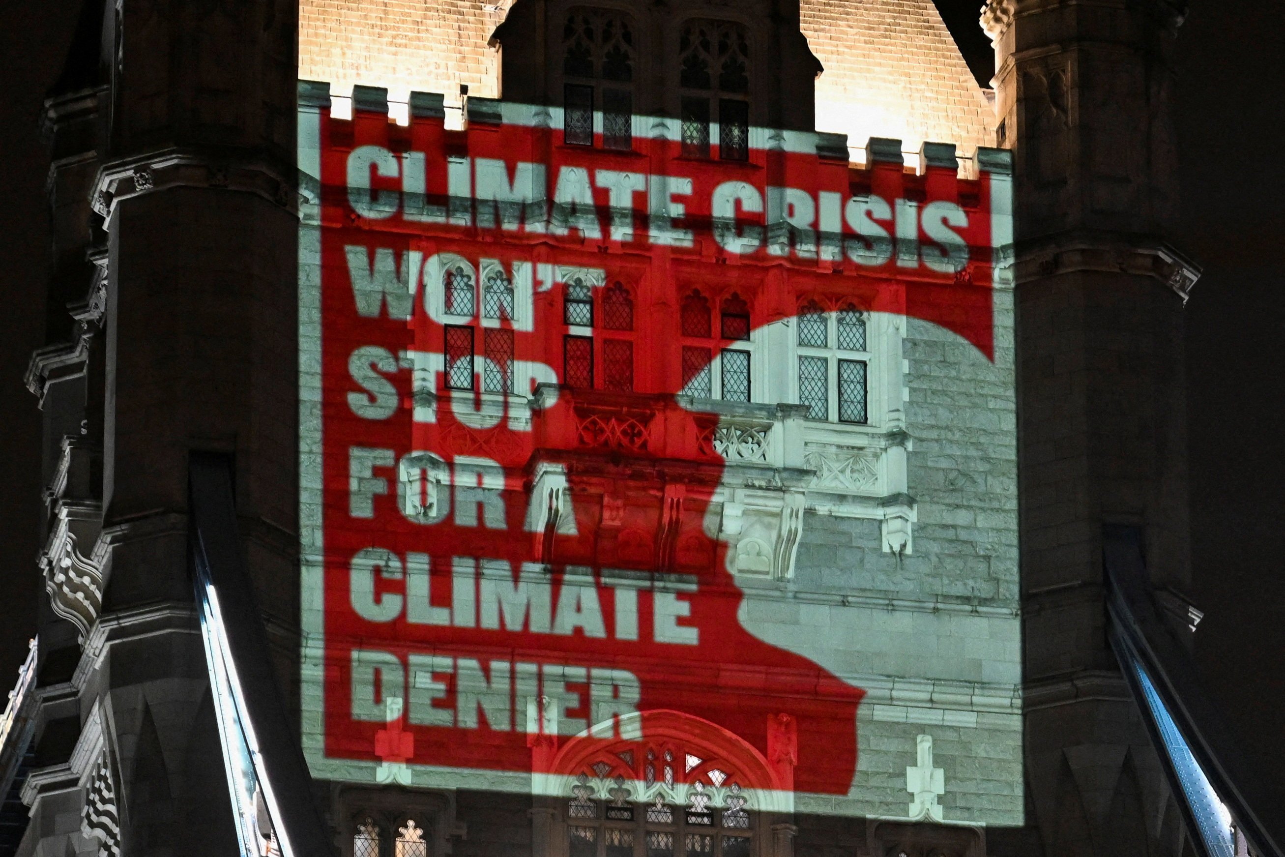 Climate activists project a message onto Tower Bridge in London, England, bearing a silhouette of US President-elect Donald Trump ahead of climate talks in the British capital on November 7, 2024. Photo: Reuters