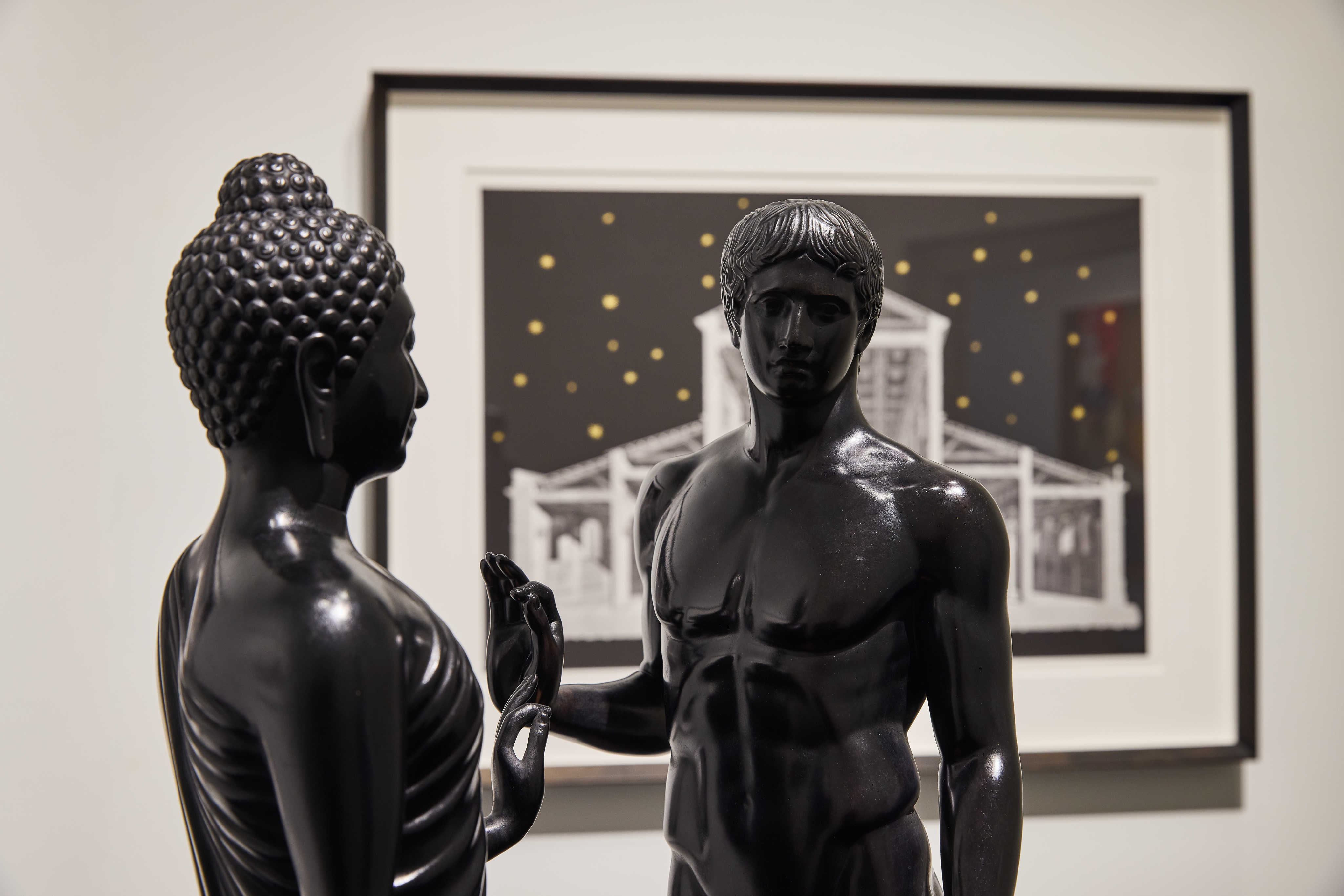 Déjà vu (2019) by Natee Utarit, a bronze work that shows the standing Buddha (left) and the classical Greek statue “The Doryphoros”, part of the Thai contemporary artist’s solo exhibition at The Private Museum in Singapore. Photo: The Private Museum