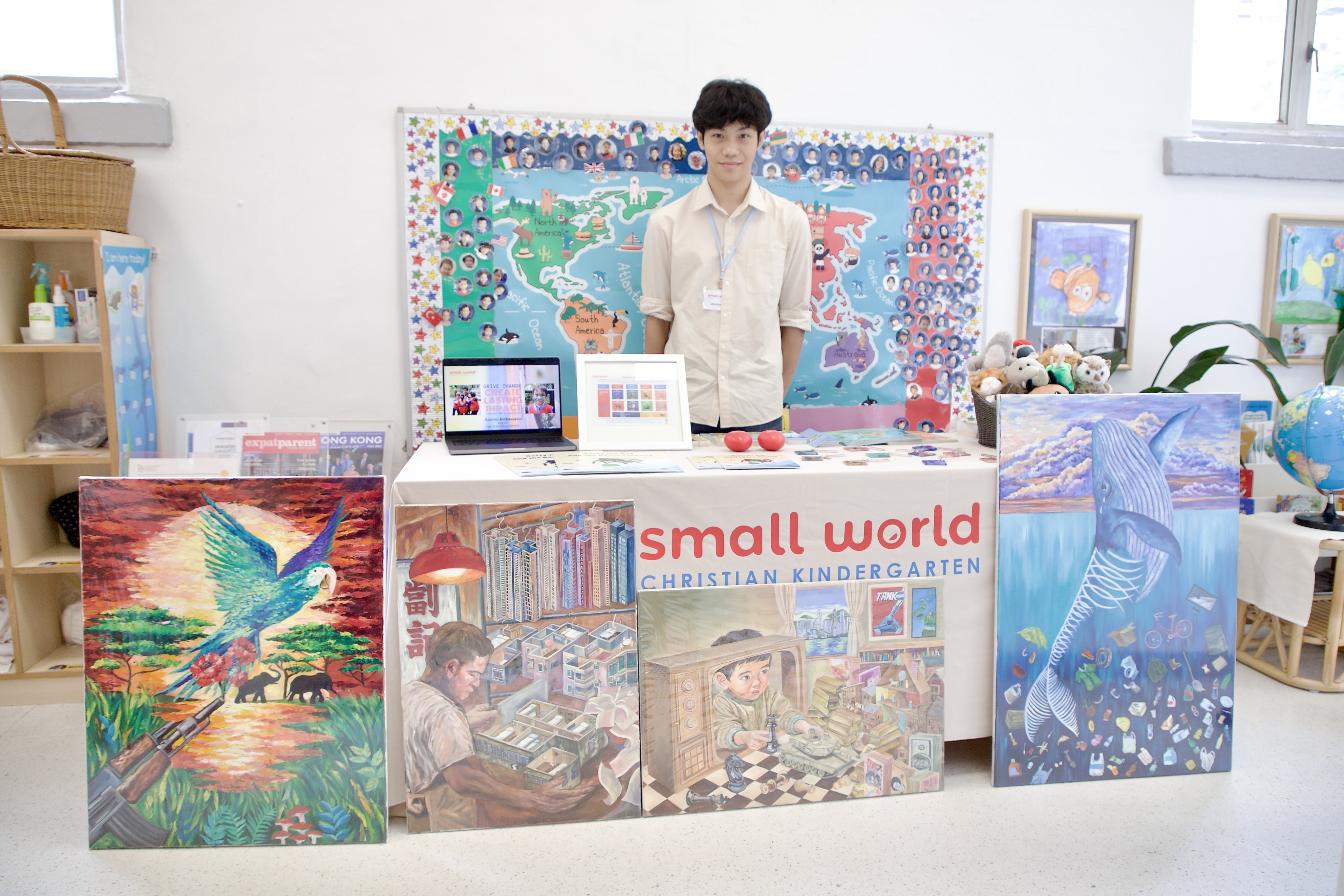 Kan King-lun displays his books and artwork at Small World Christian Kindergarten. Photo: Handout
