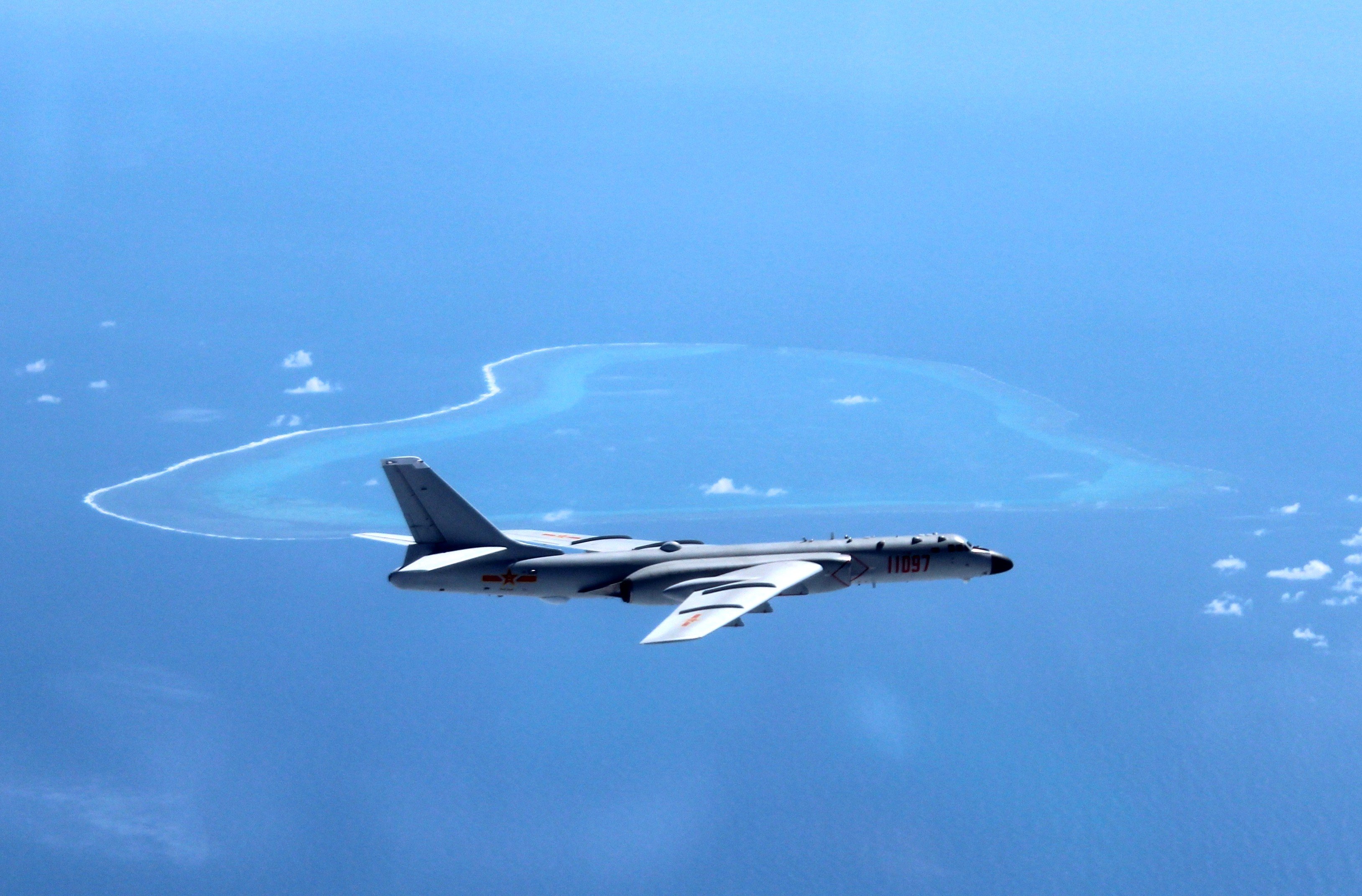 A Chinese warplane patrols islands and reefs in the South China Sea including Scarborough Shoal, claimed by China as Huangyan Island and by the Philippines as Panatag Shoal. Photo: Xinhua