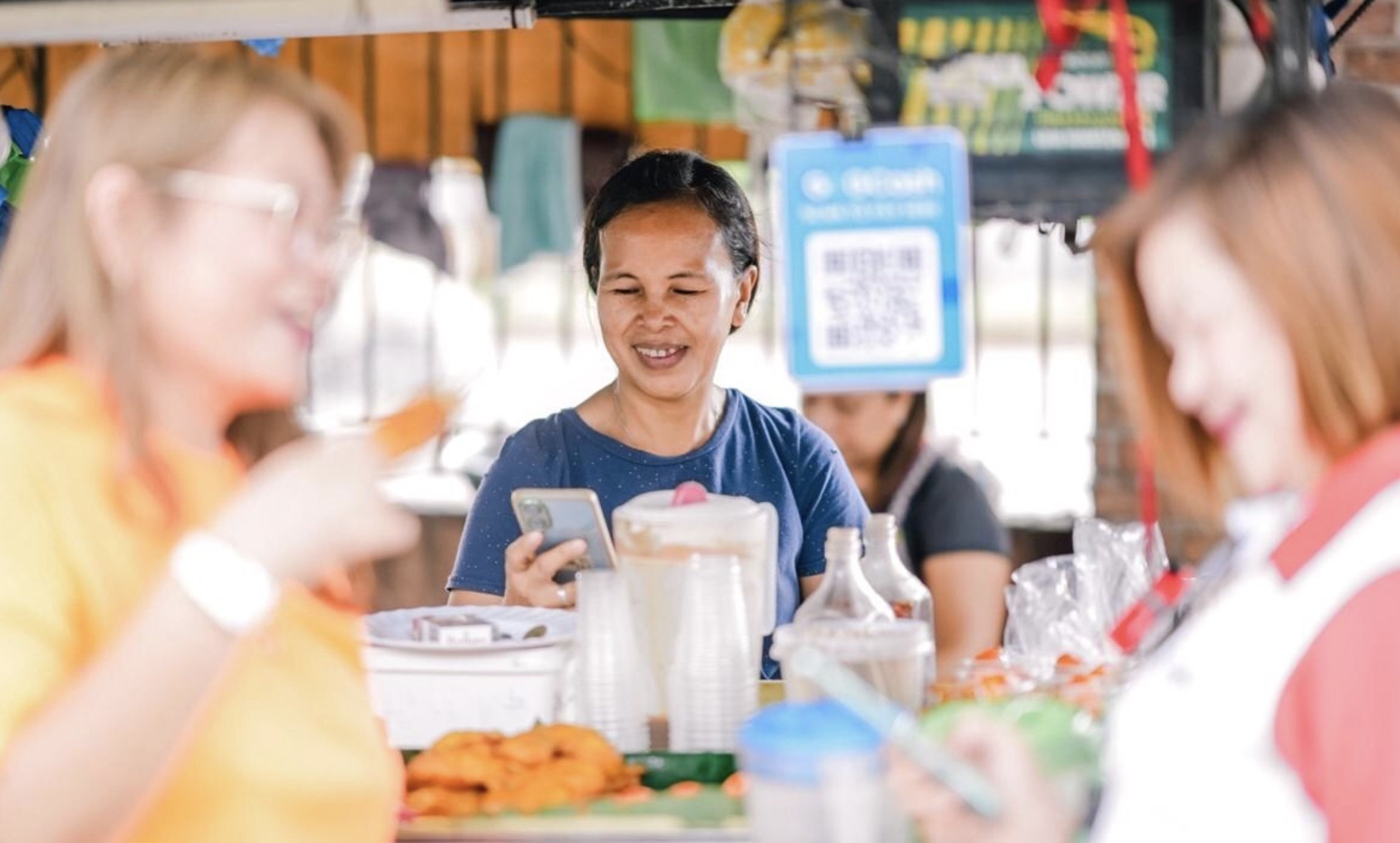 A woman using the GCash app in the Philippines. Photo: Handout