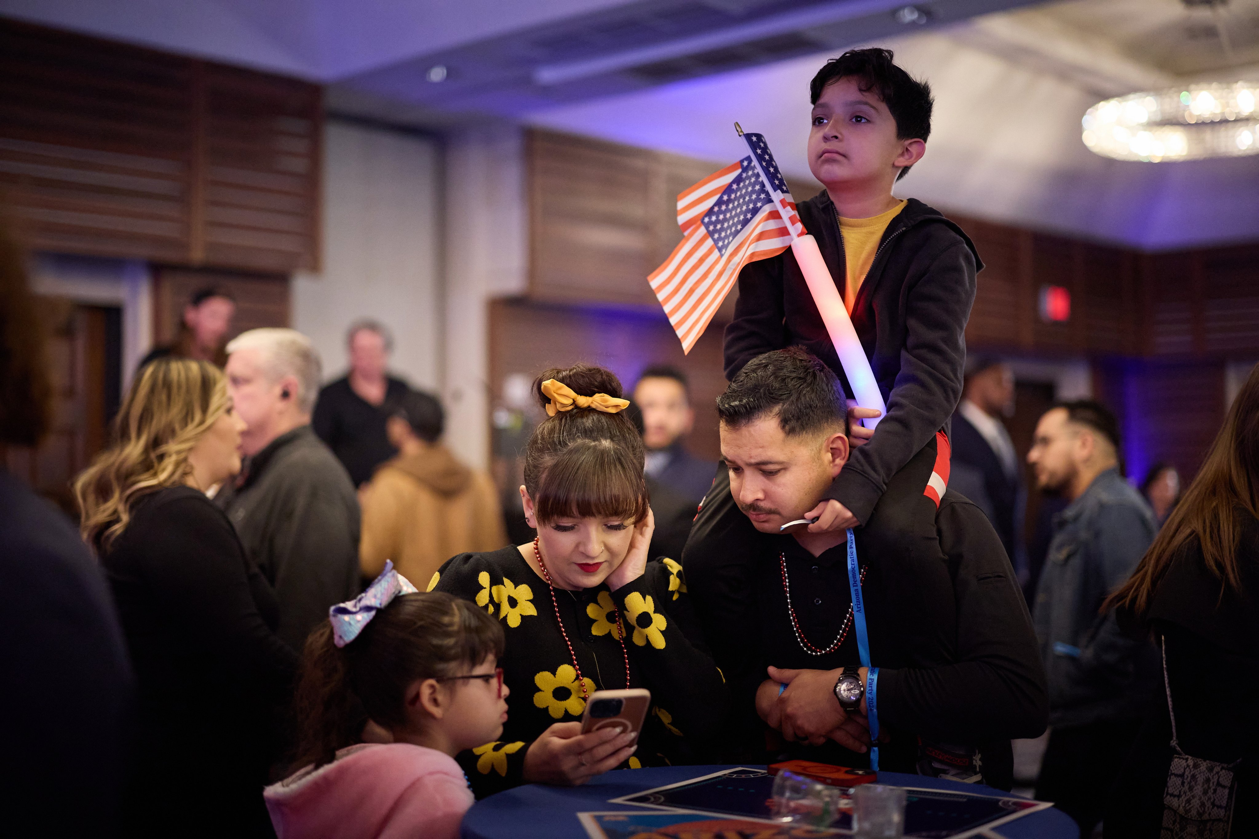 A family watches election results at the 2024 Arizona Democratic Party Election Night Watch Party in Phoenix, Arizona, on November 5. Photo:  EPA-EFE