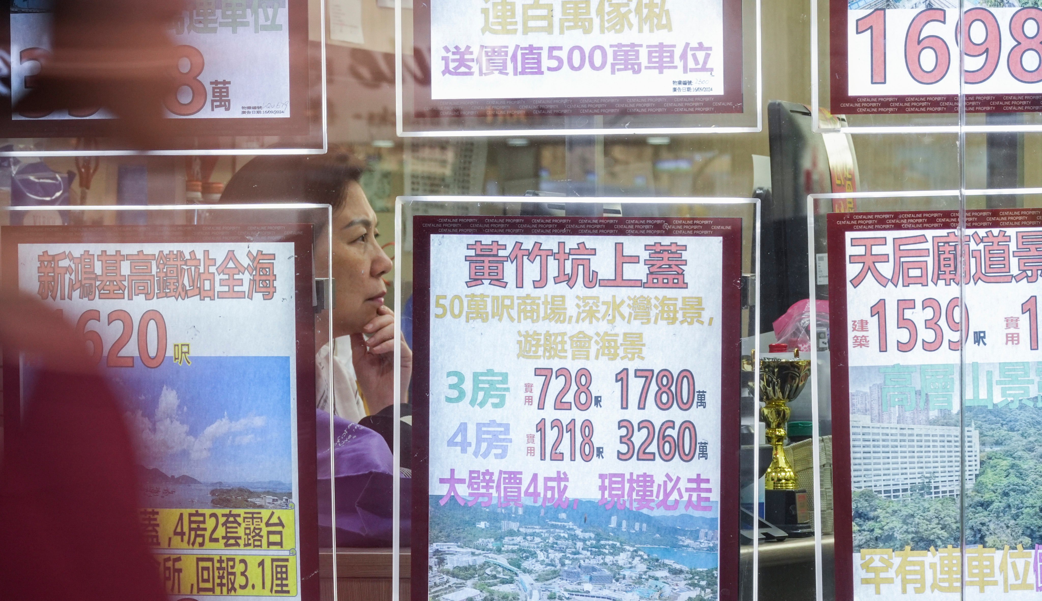 Staff work at a real estate agency in North Point on October 29, 2024. Photo: Eugene Lee