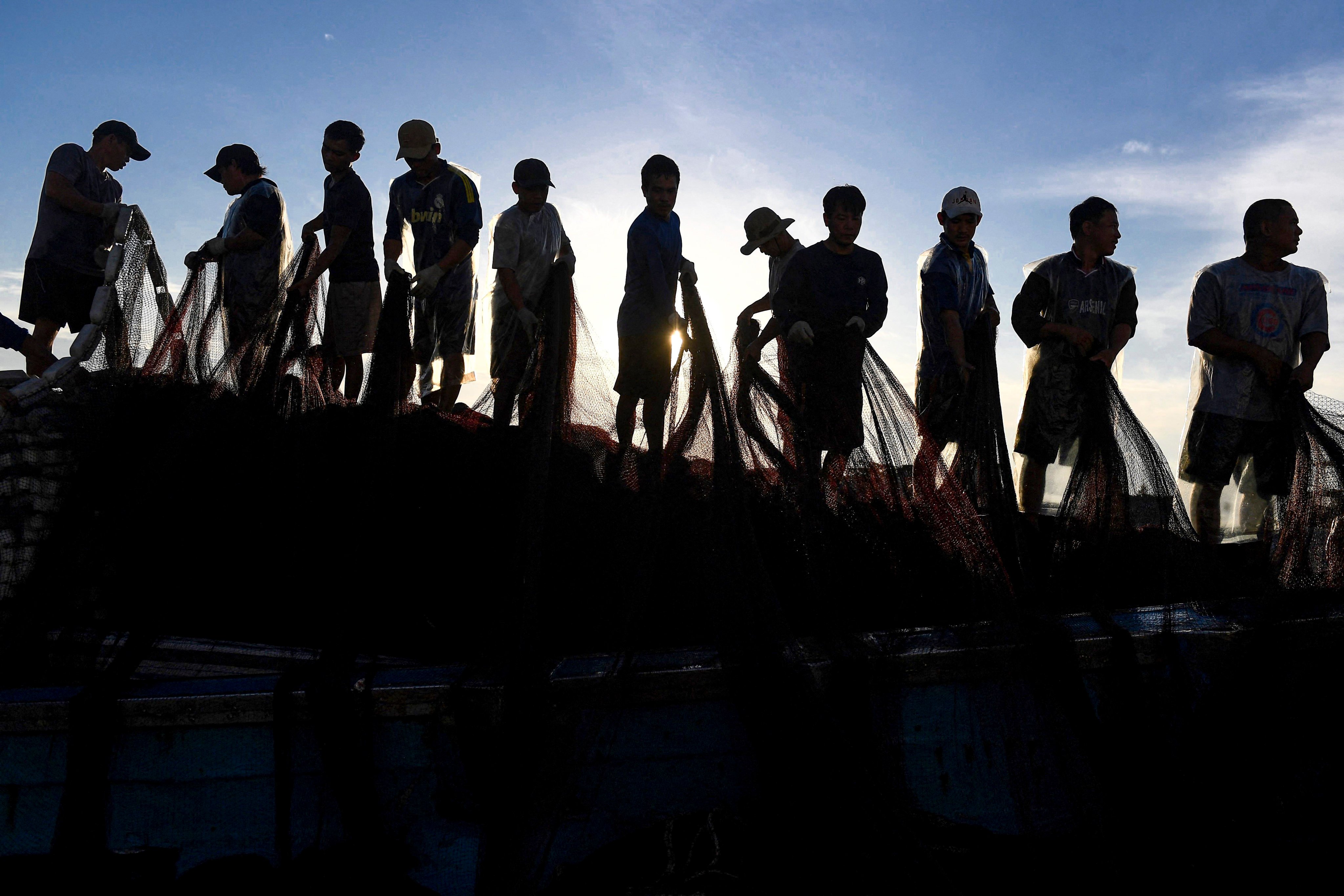 Fishermen pulling their net on Vietnam’s offshore Ly Son island close to the disputed Paracel archipelago in the South China Sea. Photo: AFP