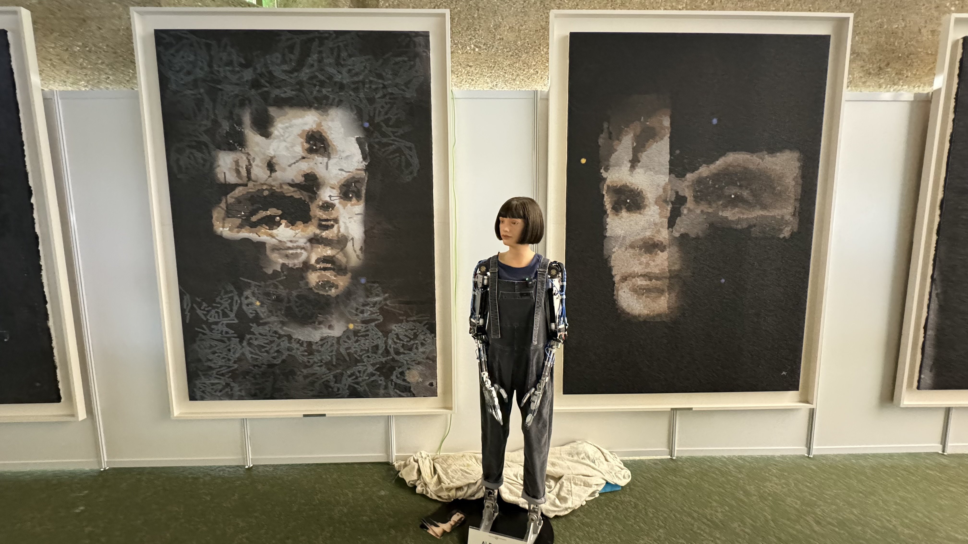 Ai-Da in front of the portrait of Alan Turing. Photo: Sotheby’s via EPA-EFE 