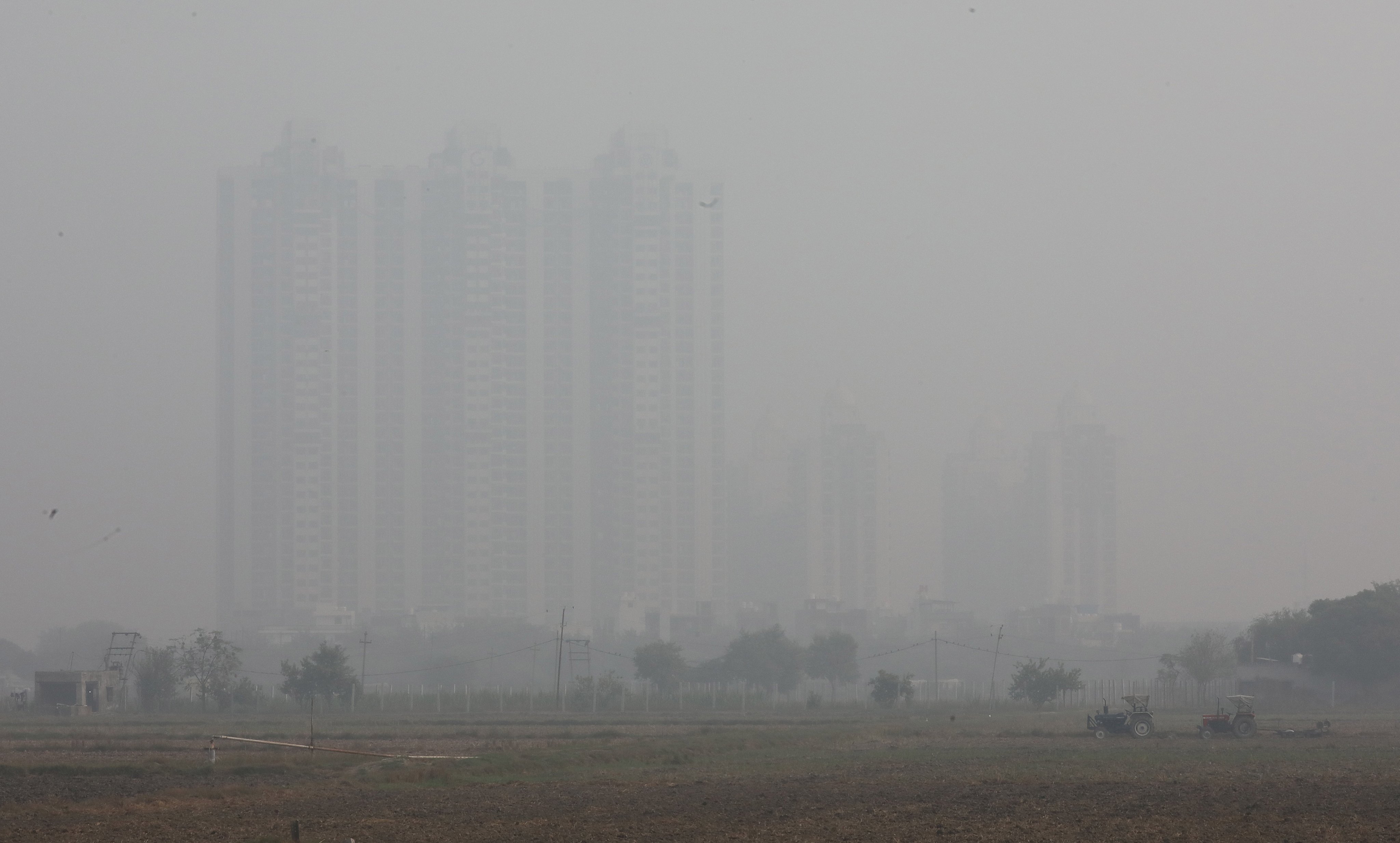 Residential complexes are covered in heavy smog near New Delhi, India, on Friday. Photo: EPA-EFE