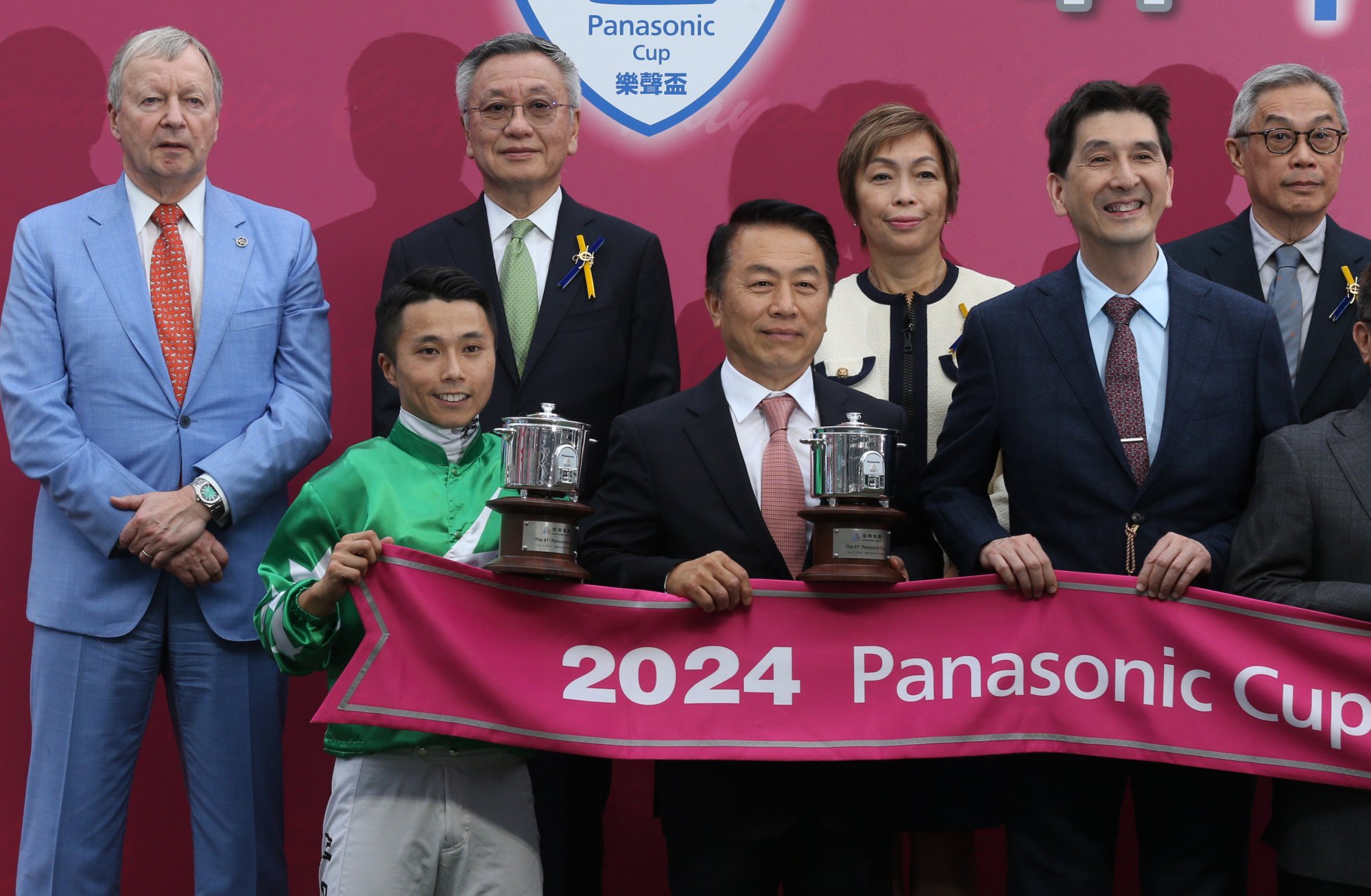 Jockey Matthew Poon and trainer Ricky Yiu with their Panasonic Cup trophies.