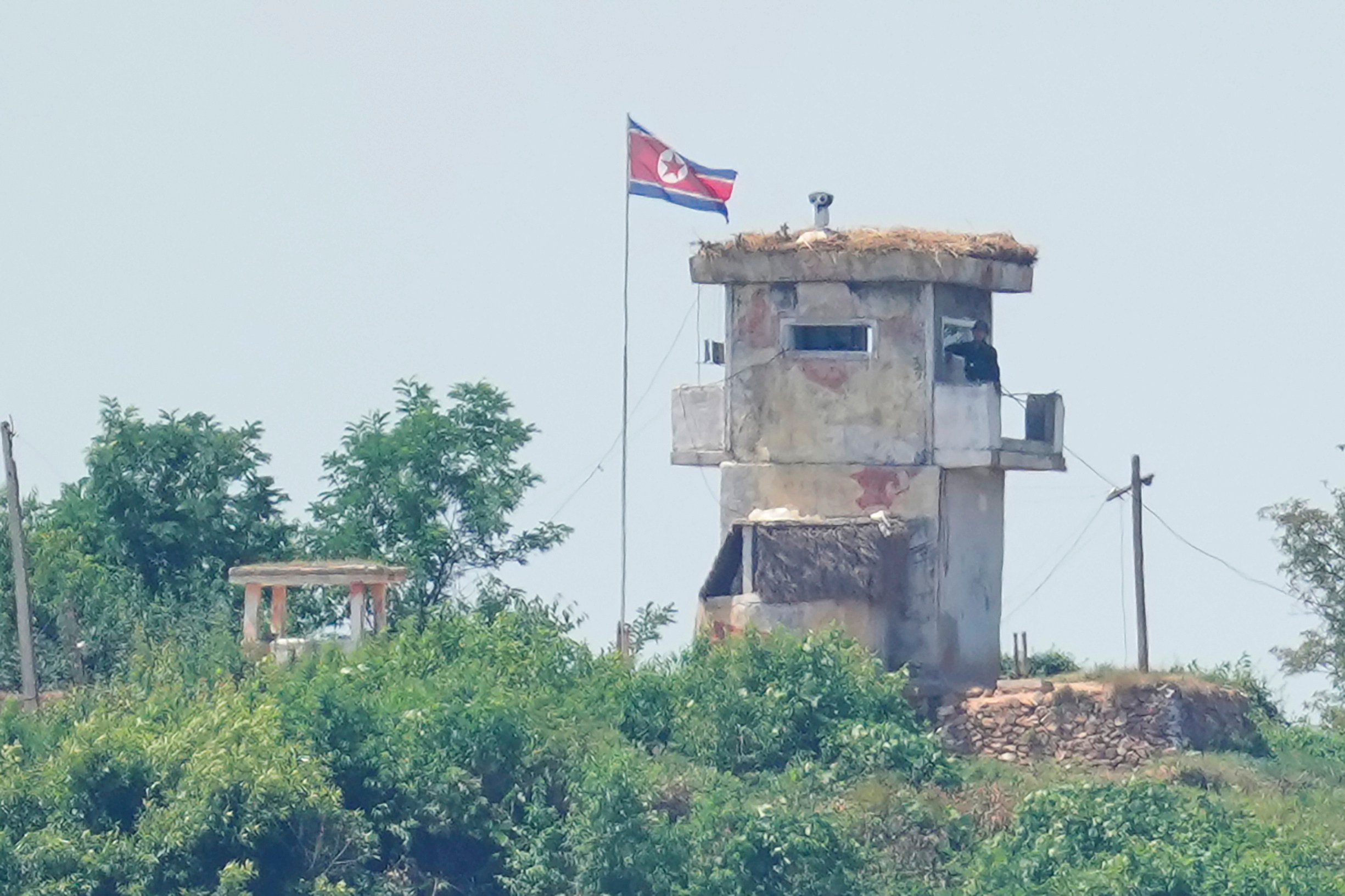 A soldier stands at a North Korean military guard post, seen from Paju, South Korea. Photo: AP