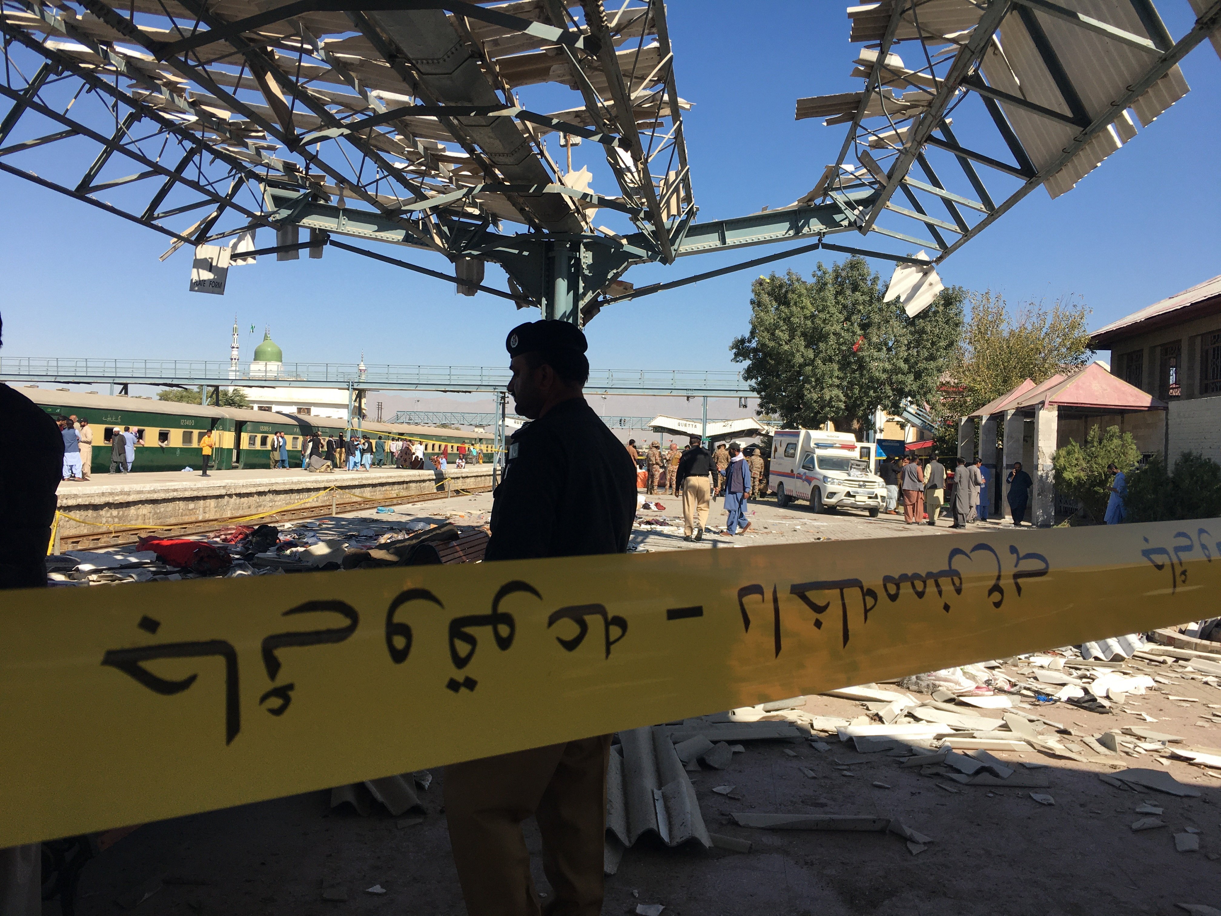 Pakistani security officials inspect the scene of a blast at a railway station in Quetta, southwestern Pakistan, on Saturday. Photo: EPA-EFE