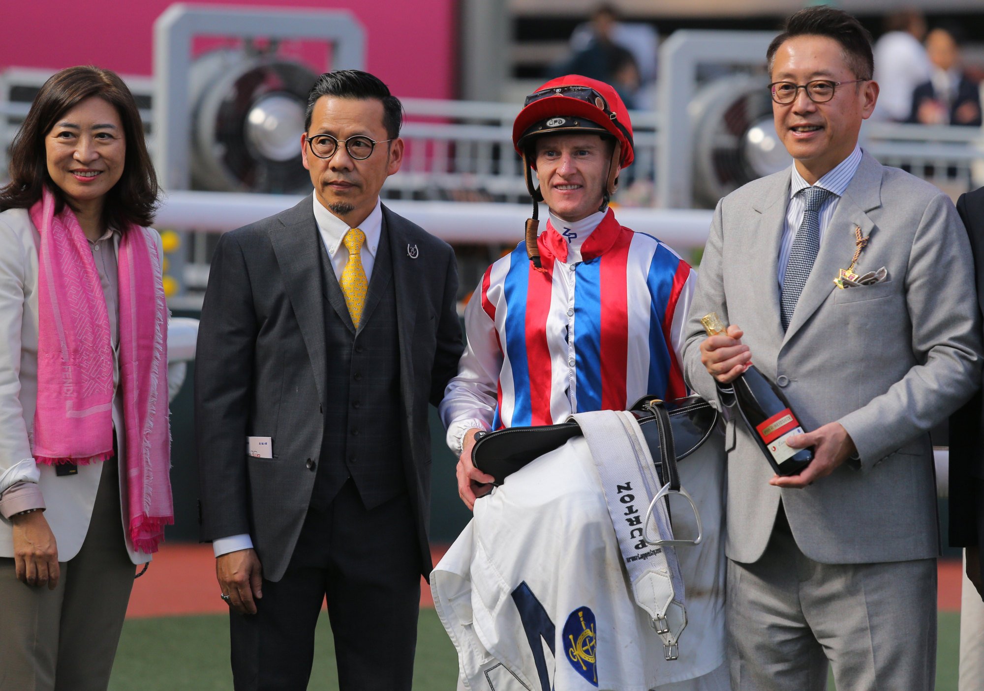 Frankie Lor (second from left), jockey Zac Purton and connections of Savvy Brilliant celebrate.