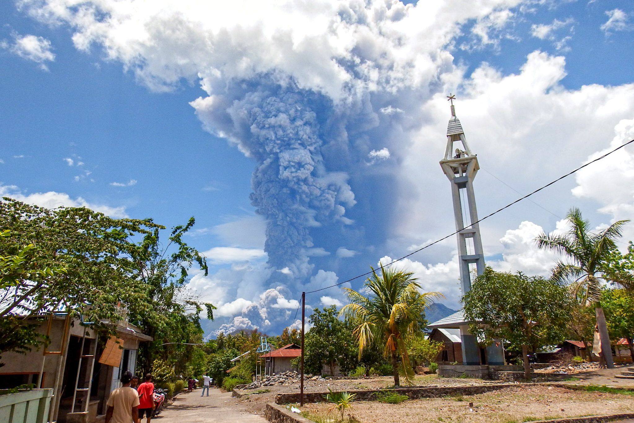 Ash and smoke spill from Mount Lewotobi Laki-Laki, as seen from Lewolaga village in East Flores, East Nusa Tenggara, on Thursday. Photo: AFP