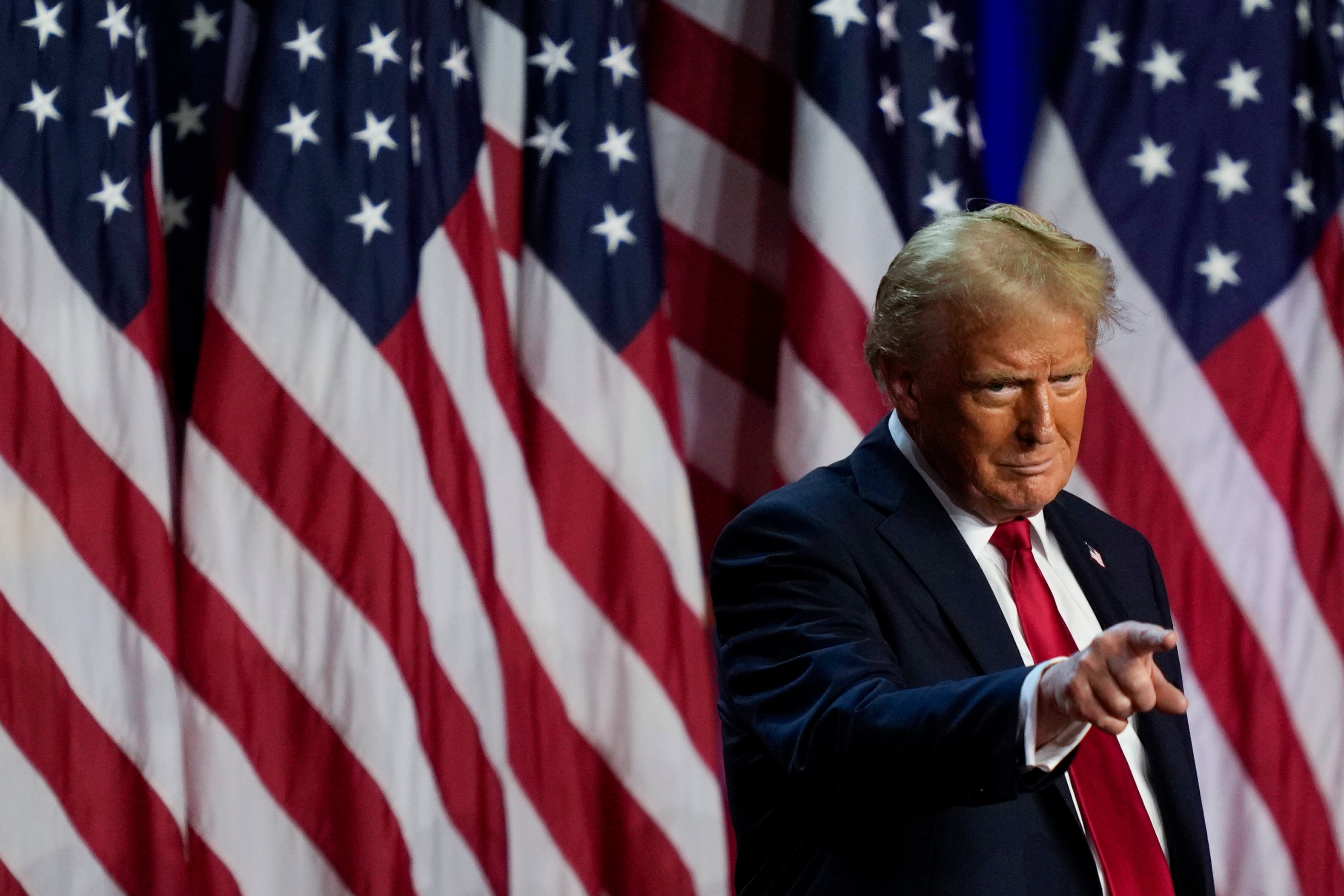 Donald Trump points to the crowd at an election night watch party in West Palm Beach, Florida, on Wednesday. Photo: AP