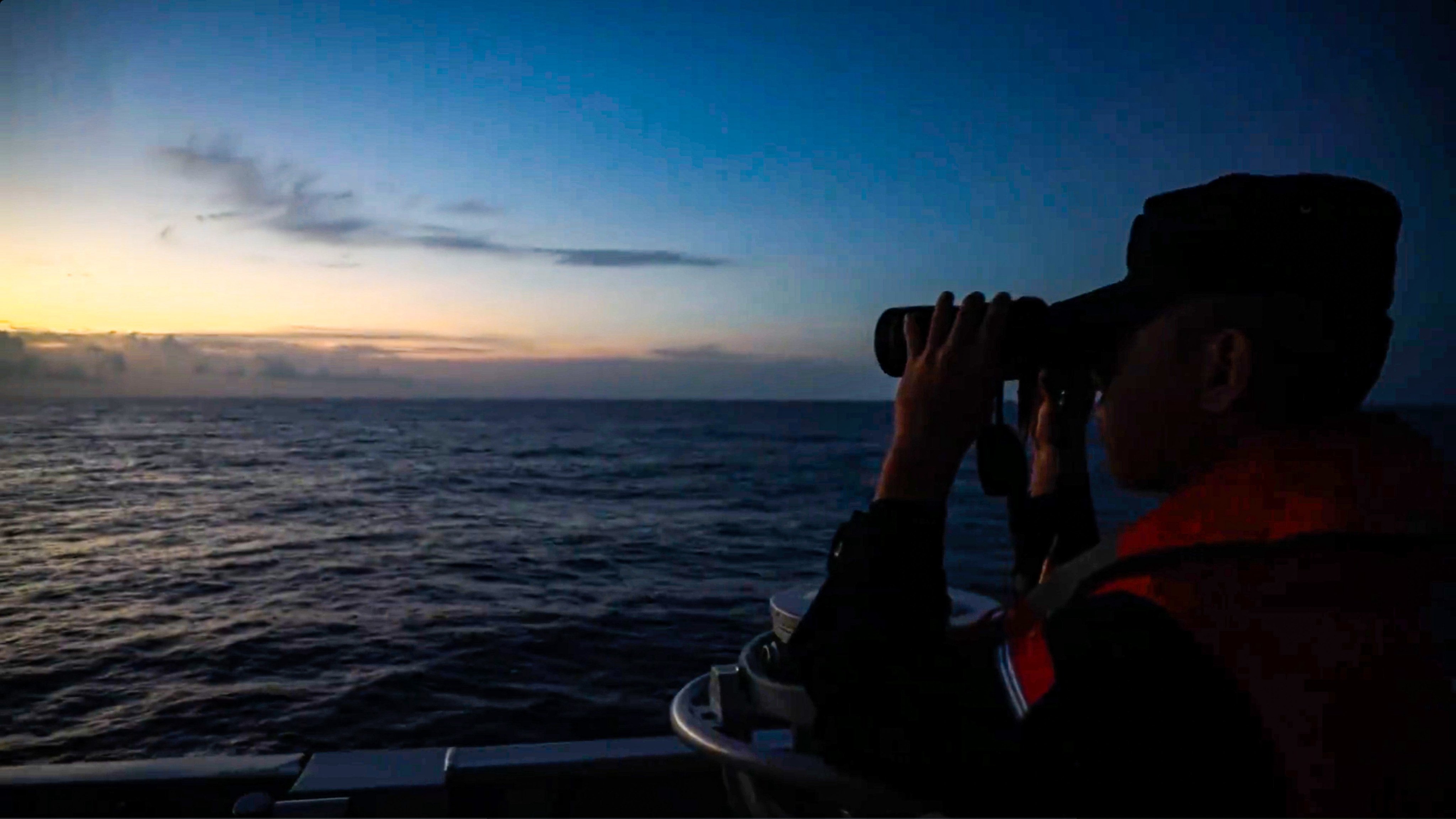 A member of the crew on a mainland Chinese vessel keeps watch as the PLA carries out drills around Taiwan, a point of contention with Washington. Photo: Handout